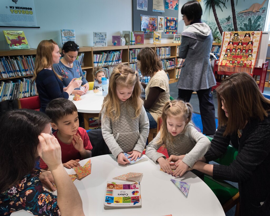 Participants fold origami during Japanese story time at Yokota Air Base, Japan, Feb. 25, 2019.