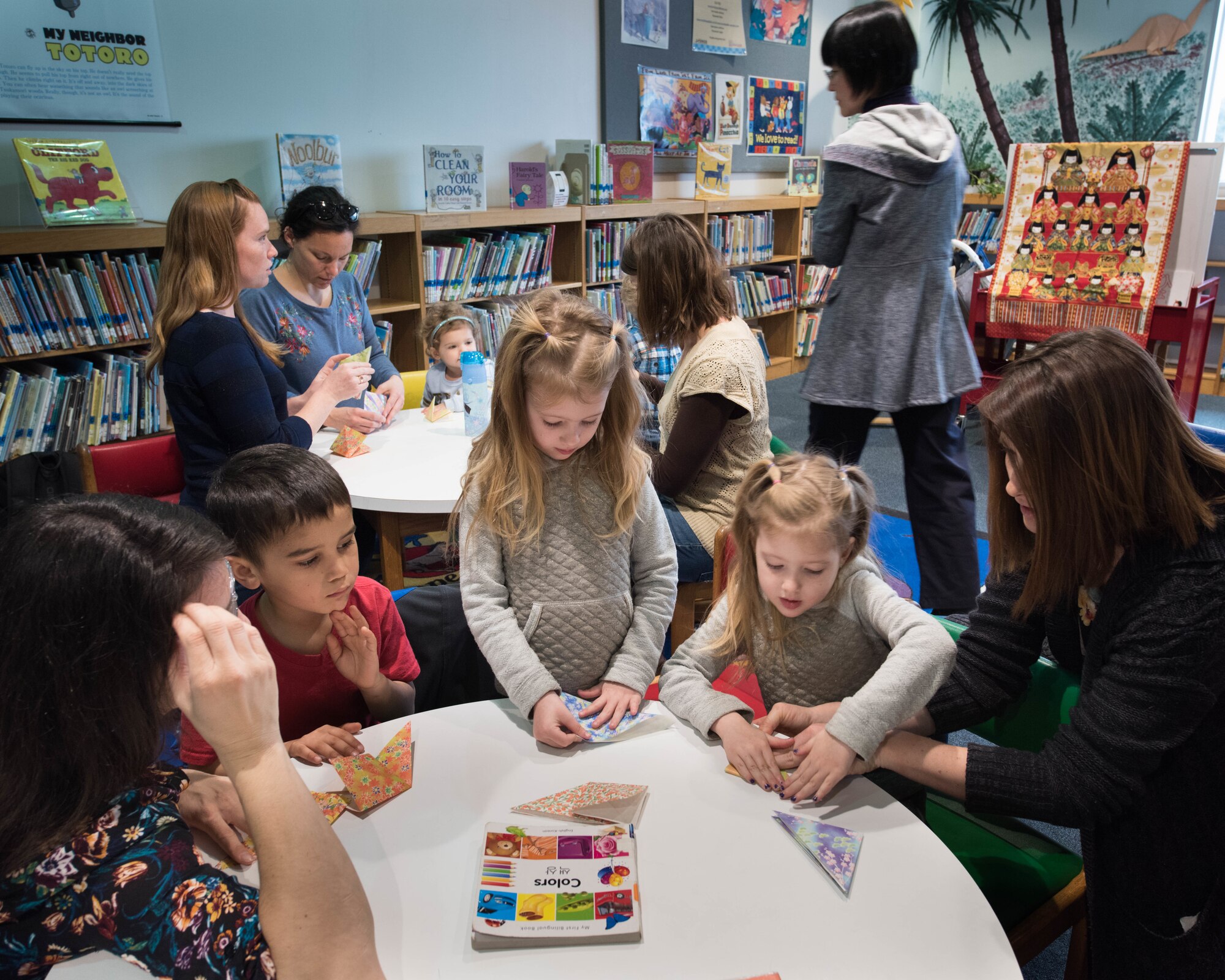 Participants fold origami during Japanese story time at Yokota Air Base, Japan, Feb. 25, 2019.