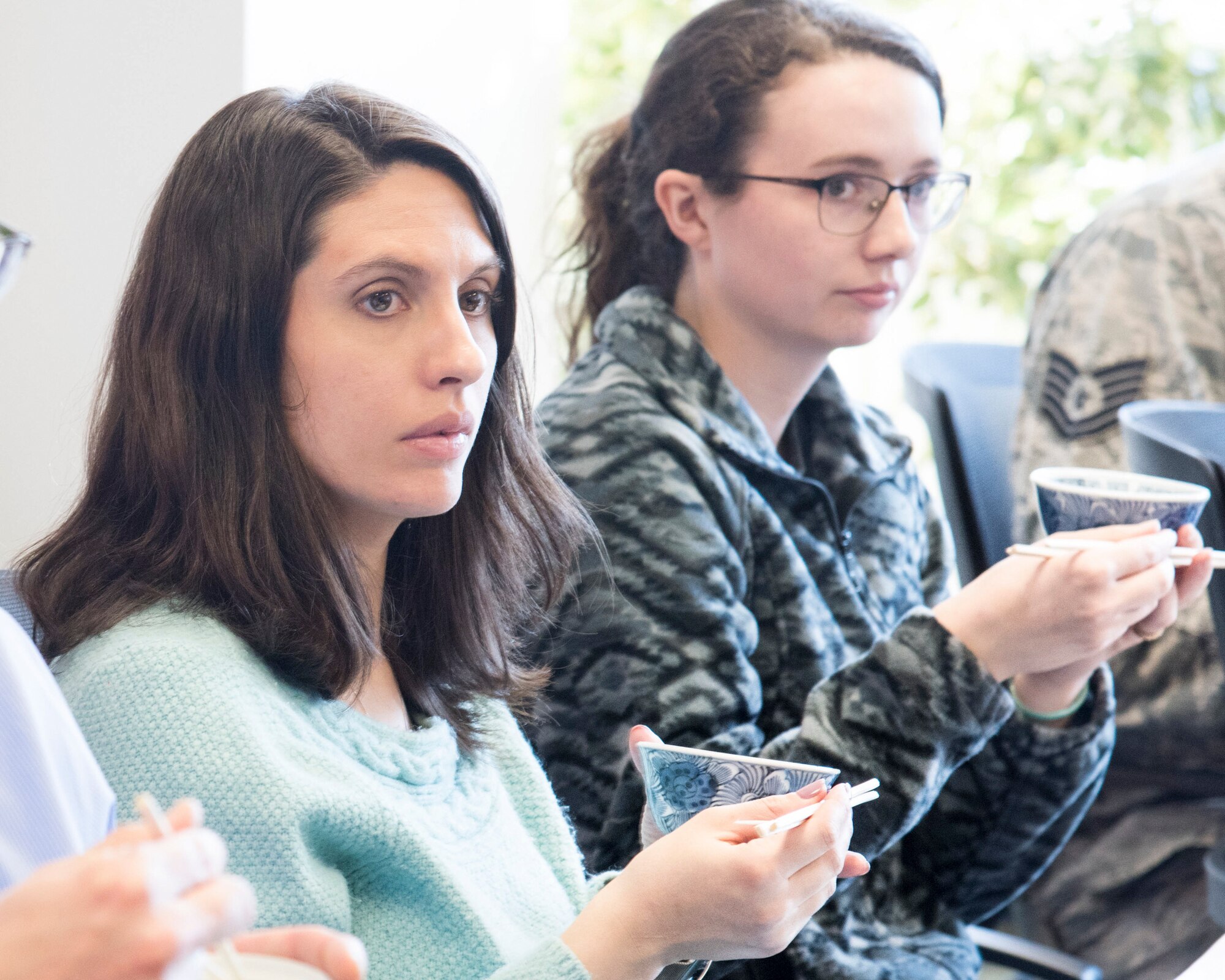 Participants practice handling chop sticks during Japanese customs and courtesies class at Yokota Air Base, Japan, Feb. 25, 2019.