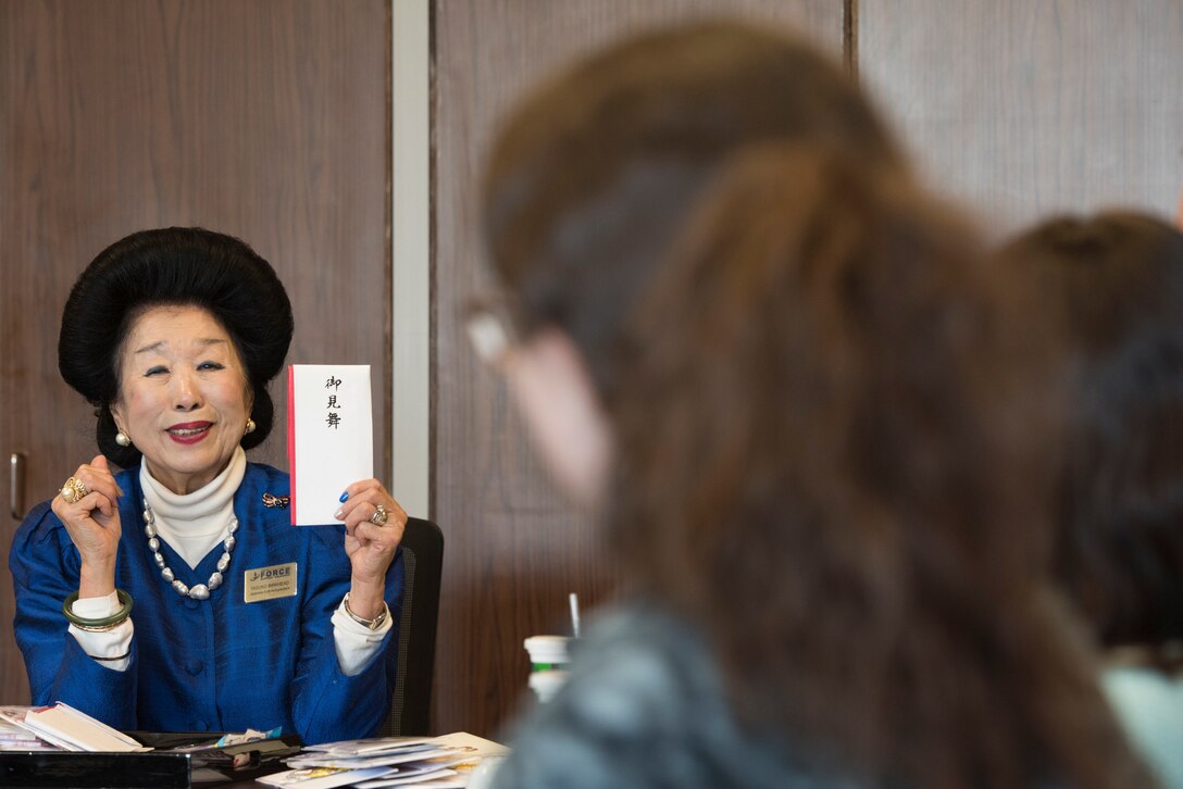 Yasuko Birkhead, 374th Force Support Squadron Japanese cultural adaptation instructor, gives a brief on manner of money gift in Japan during Japanese customs and courtesies class at Yokota Air Base, Japan, Feb. 25, 2019.