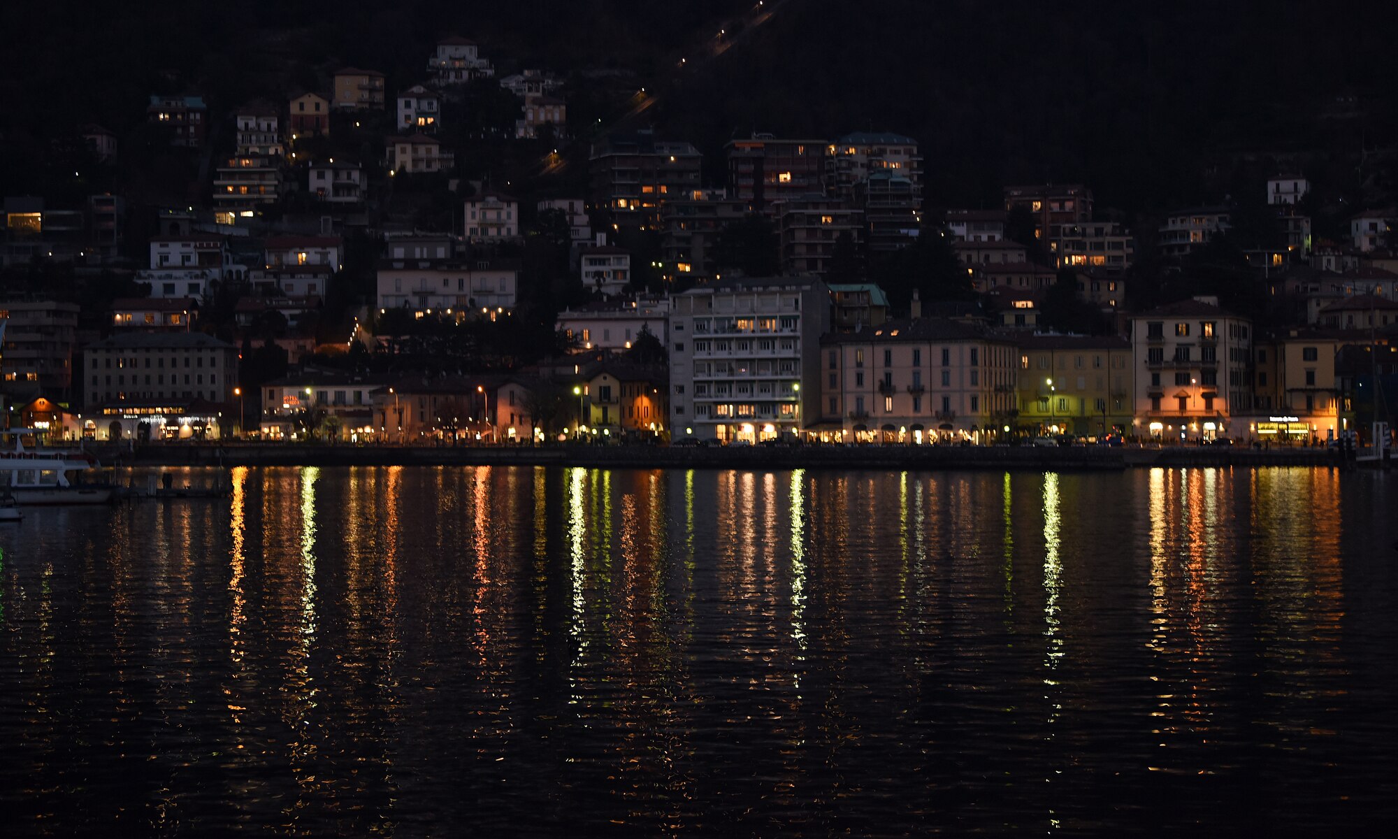 The city lights reflect onto Lake Como, Italy, Jan. 20, 2019. Lake Como has been a tourist destination since the days of the Roman Empire. (U.S. Air Force photo by Airman 1st Class Madeline Herzog)