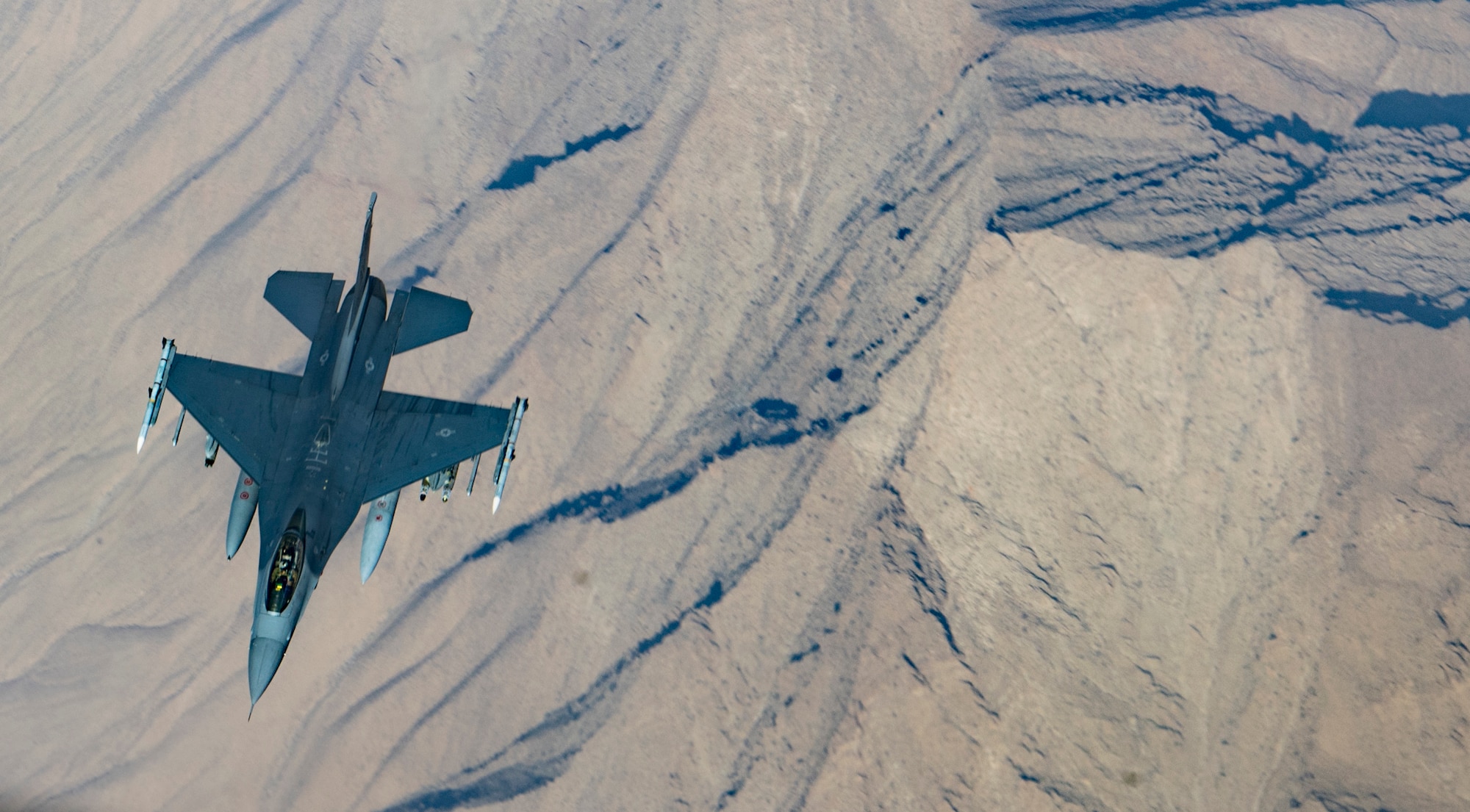 A U.S. Air Force F-16 Fighting Falcon breaks away after being refueling by a KC-135 Stratotanker from the 340th Expeditionary Air Refueling Squadron over Afghanistan, Jan. 21, 2019. The 340 EARS maintain a 24/7 presence in the U.S. Central Command area of responsibility, supporting U.S. and coalition aircraft in various operations in countries such as Iraq, Syria and Afghanistan. (U.S. Air Force Photo by Staff Sgt. Clayton Cupit)