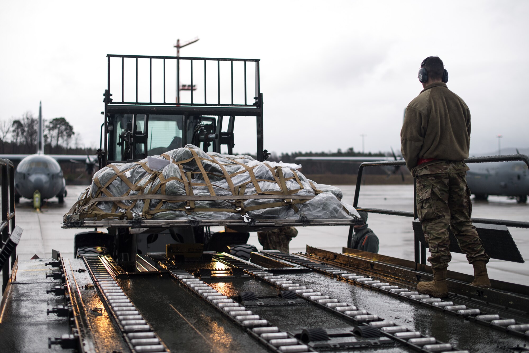 U.S. Air Force Airmen assigned to the 86th Logistics Readiness Squadron load cargo onto a 60k loader on the flight line at Ramstein Air Base, Germany, March 1, 2019. The cargo was then transferred onto a C-130J Super Hercules as part of a week-long exercise in conjunction with Operation Varsity, a wing commander initiative designed to enhance contingency capabilities. (U.S. Air Force photo by Staff Sgt. Devin Boyer)