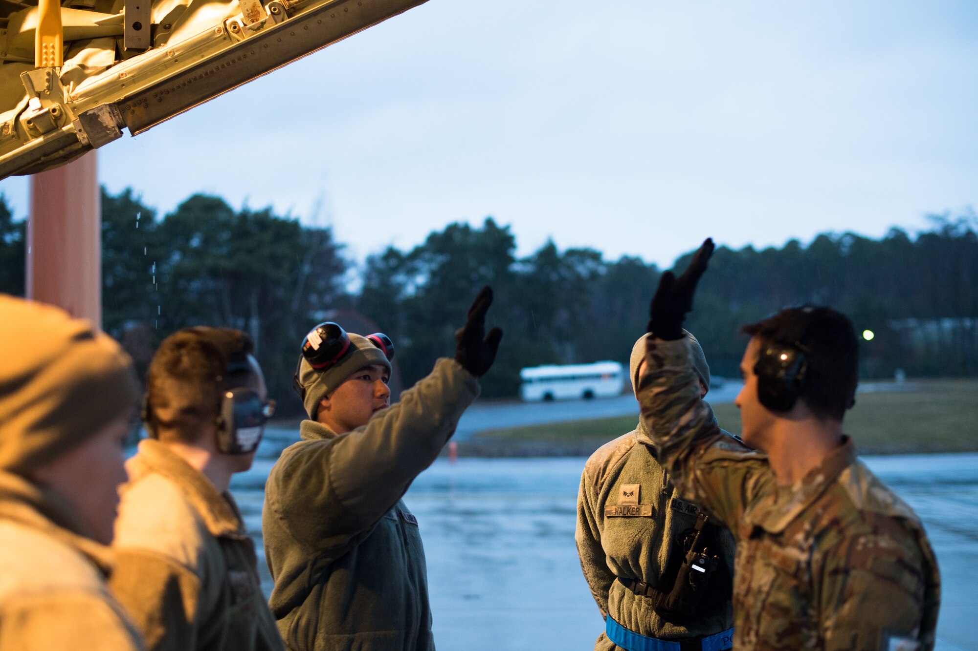 U.S. Air Force Tech. Sgt. Victor Garcia-Colon, 86th Logistics Readiness Squadron cargo deployment function noncommissioned officer in charge, right, gives a high five to Staff Sgt. Austin Oshiro, 721st Aerial Port Squadron ramp services supervisor, on the flightline at Ramstein Air Base, Germany, March 1, 2019. The team completed a cargo upload briefing moments before loading a C-130J Super Hercules with a forklift and pallet. (U.S. Air Force photo by Staff Sgt. Devin Boyer)