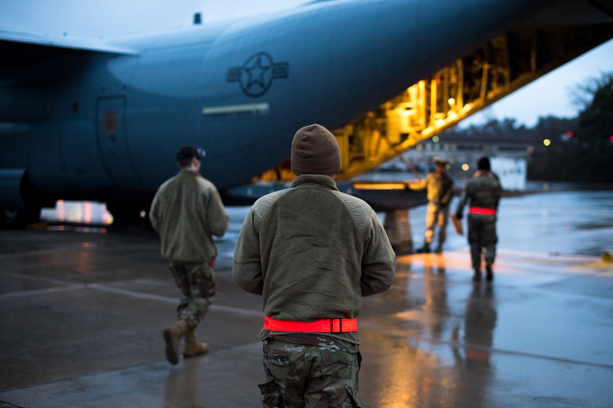 U.S. Air Force Airmen assigned to the 86th Logistics Readiness Squadron approach a C-130J Super Hercules on the flightline at Ramstein Air Base, Germany, March 1, 2019. The team headed out to the aircraft during a week-long exercise to practice procedures in non-traditional environments. The exercise is part of Operation Varsity, a wing commander initiative designed to enhance contingency capabilities. (U.S. Air Force photo by Staff Sgt. Devin Boyer)
