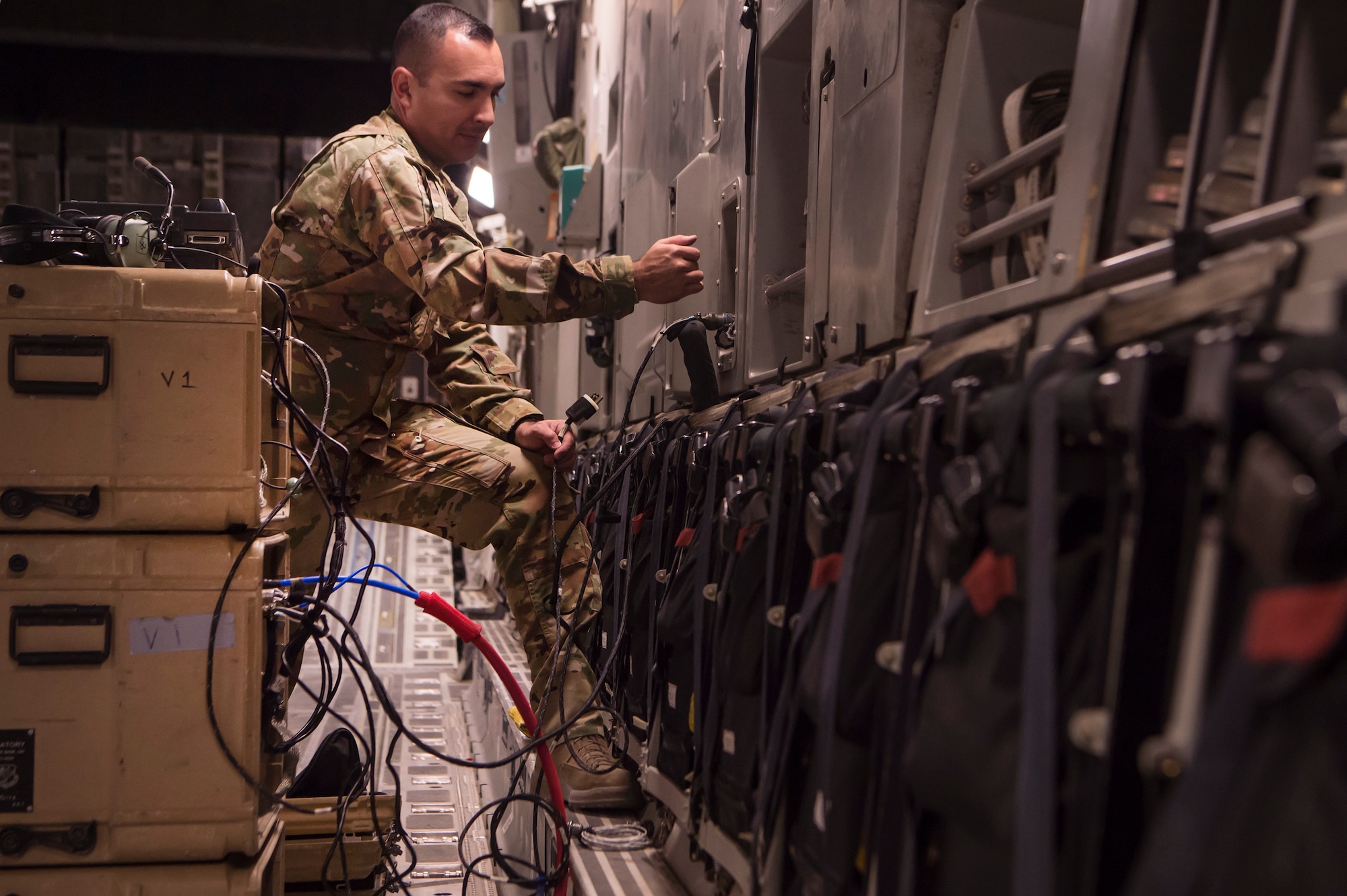 Master Sgt. Richard Barragan, 379th Expeditionary Communications Squadron Viper team lead, sets up an “HSD-400” radio system on a C-17 Globemaster III March 5, 2019, at Al Udeid Air Base, Qatar.
