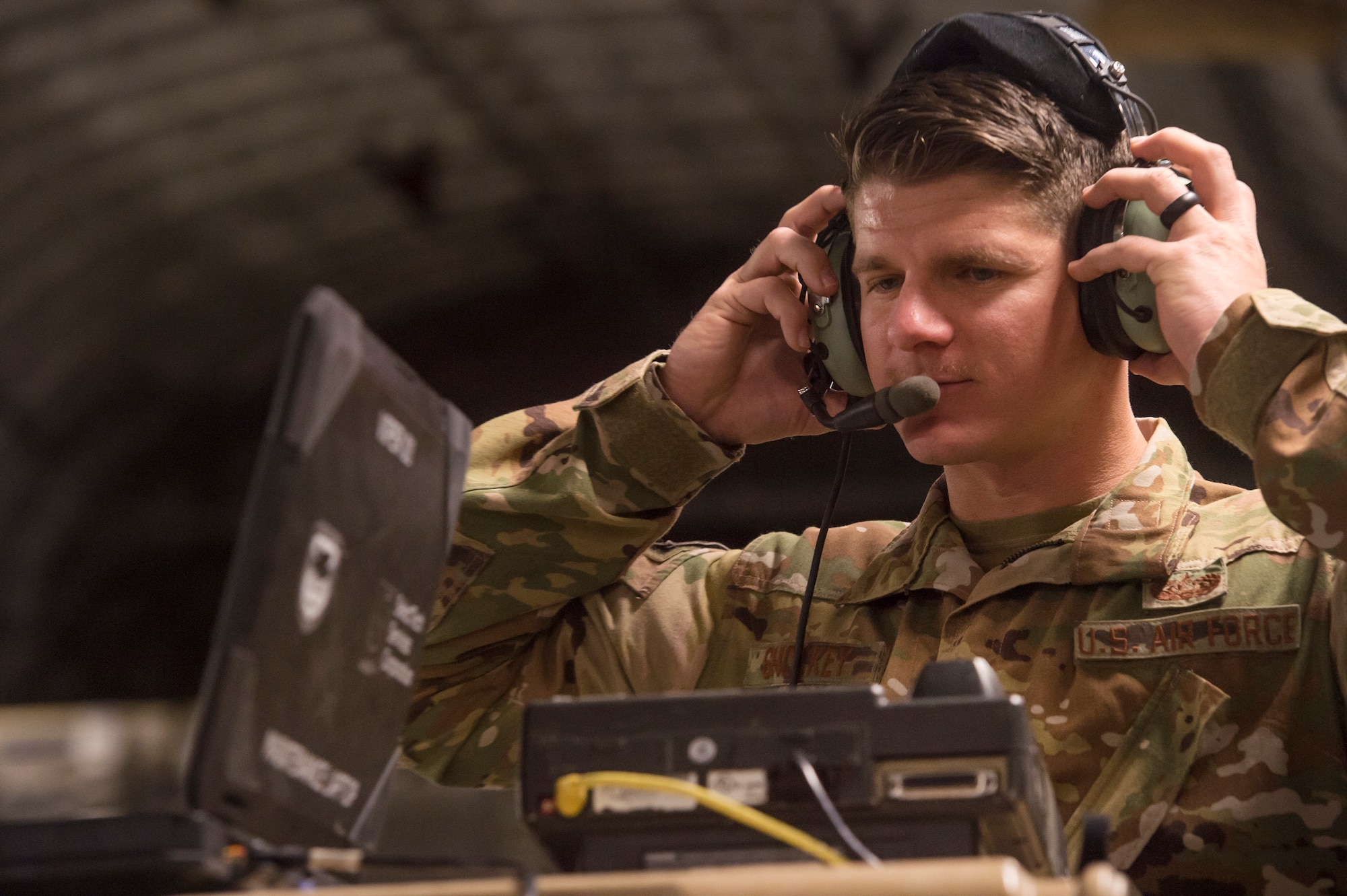 Tech. Sgt. Stephen Shockey, 379th Expeditionary Communications Squadron Viper team operator, tests the functionality of an “HSD-400” radio system on a C-17 Globemaster III March 5, 2019, at Al Udeid Air Base, Qatar.