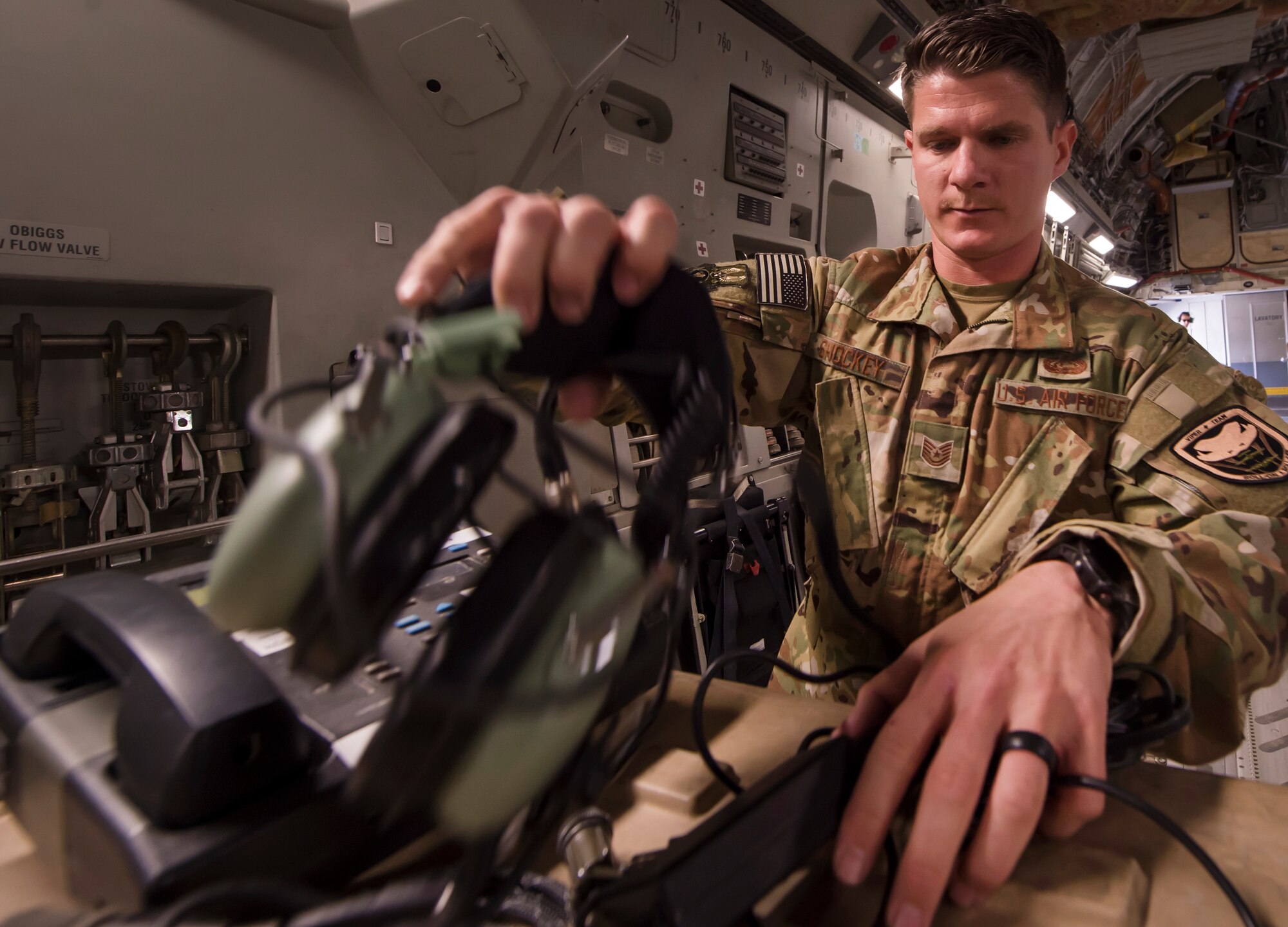 Tech. Sgt. Stephen Shockey, 379th Expeditionary Communications Squadron Viper team operator, sets up an “HSD-400” radio system on a C-17 Globemaster III March 5, 2019, at Al Udeid Air Base, Qatar.