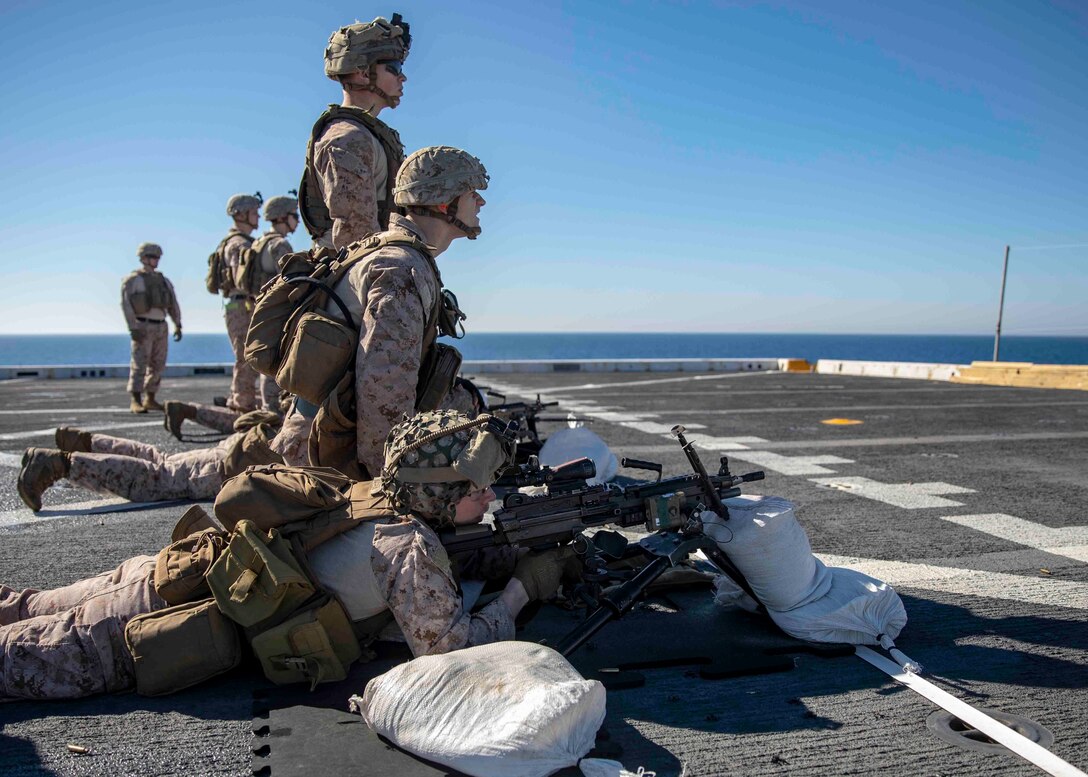 U.S. Marines with the 22nd Marine Expeditionary Unit practice zero M249 squad automatic weapons during a live-fire training exercise on the flight deck of the San Antonio-class amphibious transport dock ship USS Arlington, March 5, 2019. The USS Arlington is making a scheduled deployment as part of the 22nd MEU and the Kearsarge Amphibious Ready Group, in support of maritime security operations, crisis response and theater security cooperation, while also providing a forward Naval and Marine presence. (U.S. Marine Corps photo by Staff Sgt. Andrew Ochoa)