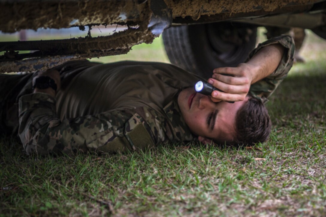 Airman 1st Class Paul Giampaolo, 822d Base Defense Squadron fireteam member, searches a vehicle during Scorpion Stakes, Feb. 20, 2019, at Moody Air Force Base, Ga. The Airmen had to search two vehicles for up to 20 unauthorized items. The event has 18 four-Airman teams who are competing for 1st, 2nd and 3rd place by getting the highest score at the 18 different stations. (U.S. Air Force photo by Airman 1st Class Taryn Butler)