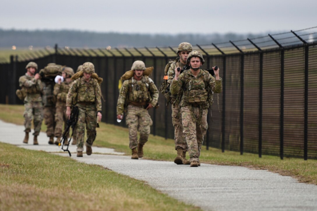 Airmen assigned to the 822d Base Defense Squadron carry a 120-pound litter on a ruck during Scorpion Stakes, Feb. 20, 2019, at Moody Air Force Base, Ga. The two-day competition includes 18 stations such as a ruck, litter carry, simulated hostage rescue and vehicle search. The event has 18 four-Airman teams who are competing for 1st, 2nd and 3rd place by getting the highest score at the 18 different stations. Scorpion Stakes challenges Airmen on their career training and knowledge while having to physically and mentally overcoming obstacles. (U.S. Air Force photo by Airman 1st Class Taryn Butler)