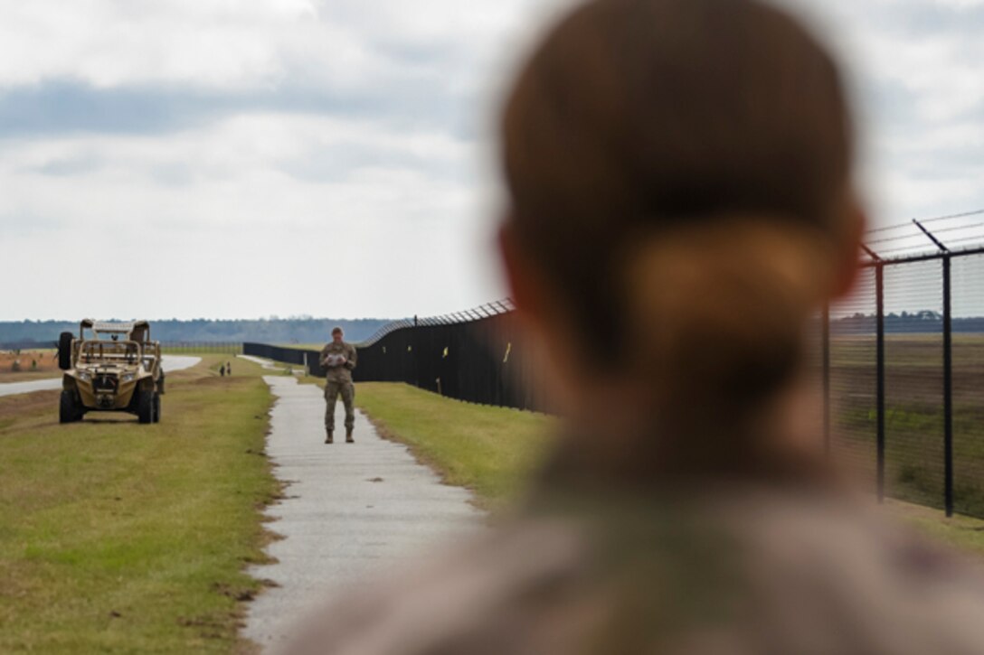 An Airman assigned to the 822d Base Defense Squadron estimates range during Scorpion Stakes, Feb. 20, 2019, at Moody Air Force Base, Ga. Airmen at this station had to estimate the range between 100 meters and 1000 meters. The competition includes 18 stations such as a ruck, litter carry, simulated hostage rescue, vehicle search. Scorpion Stakes all the day-to-day fundamental skills and job knowledge and challenges Airmen on their career training and knowledge while having to physically and mentally overcoming obstacles. (U.S. Air Force photo by Airman 1st Class Taryn Butler)