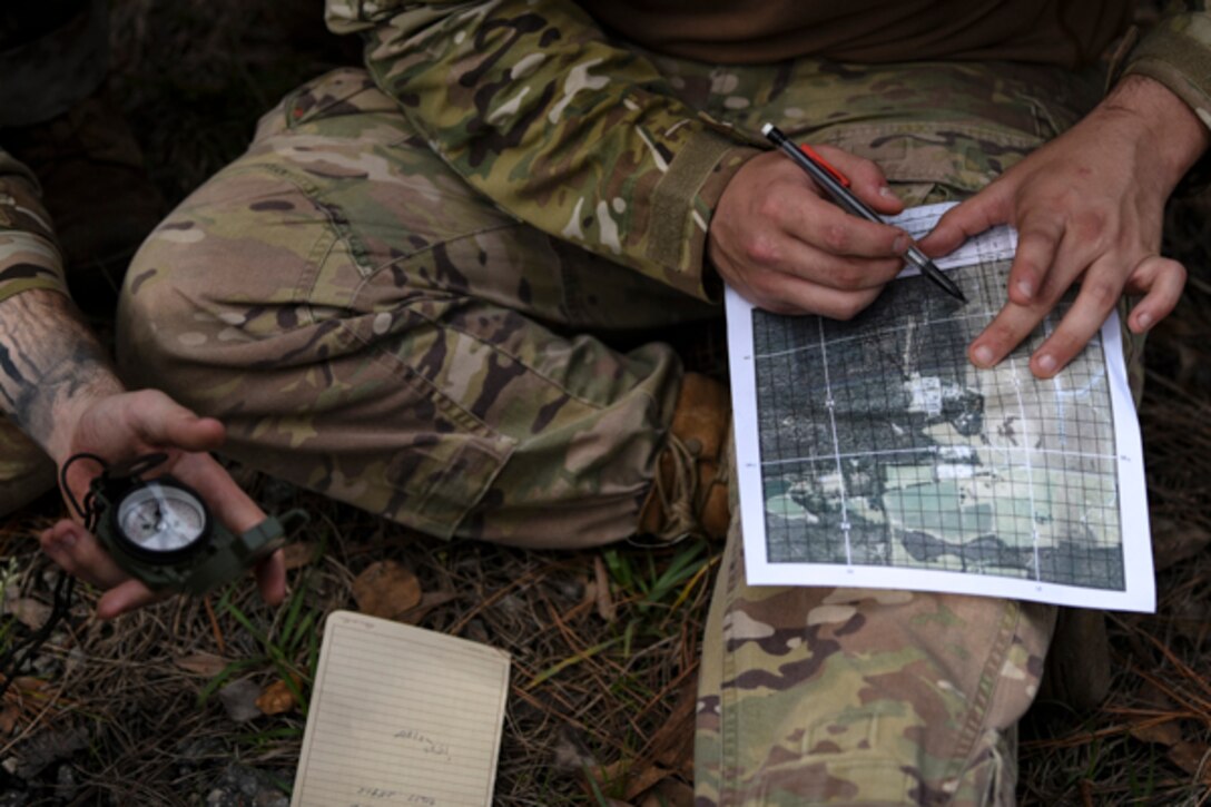 An Airman assigned to the 822d Base Defense Squadron plots points on a map during Scorpion Stakes, Feb. 20, 2019, at Moody Air Force Base, Ga. After plotting the points, the Airmen had to find the points on land and bring the item at the point back to the starting point. The competition includes 18 stations such as a ruck, litter carry, simulated hostage rescue, vehicle search. Scorpion Stakes takes all the day-to-day fundamental skills and job knowledge and challenges Airmen on their career training and knowledge while having to physically and mentally overcoming obstacles. (U.S. Air Force photo by Airman 1st Class Taryn Butler)