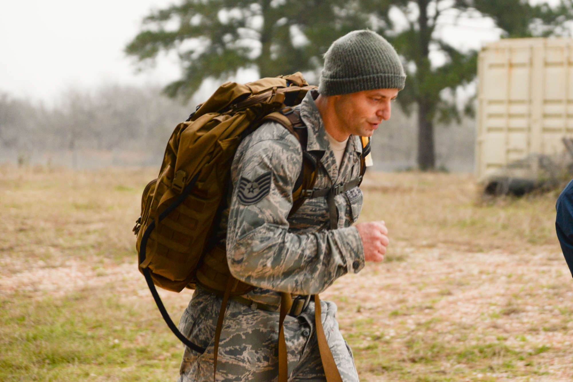 Tech. Sgt. Joshua Porter, 136th Logistics Readiness Squadron vehicle maintainer, pushes toward the finish line after a 12-mile ruck march wearing a 35-pound backpack.
