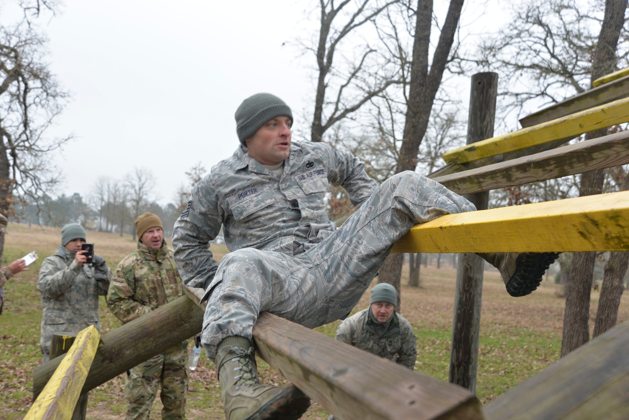 Tech. Sgt. Joshua Porter, 136th Logistics Readiness Squadron vehicle maintainer, navigates his way over and under planks during the obstacle course.