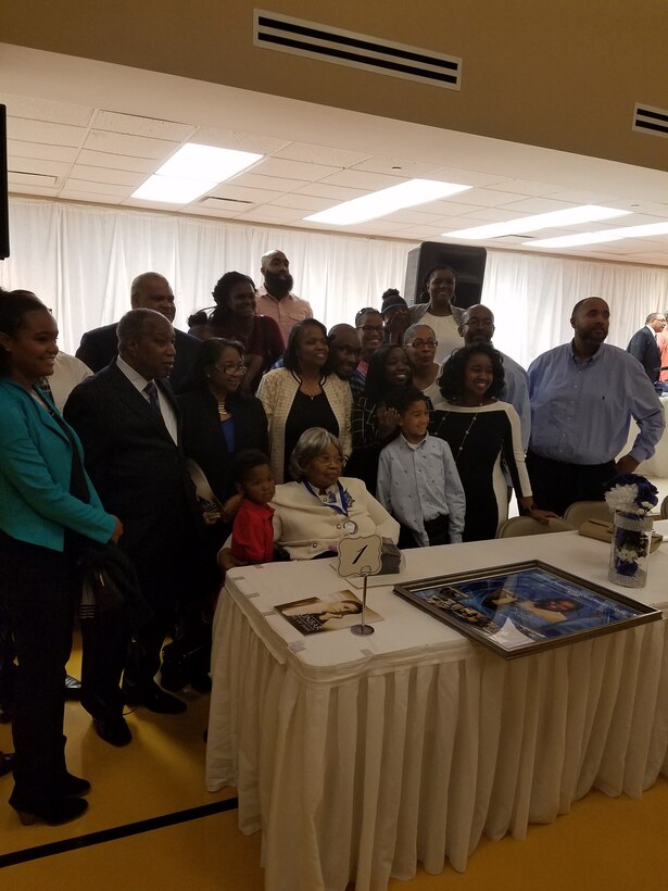Phyllis Bolds is surrounded by family after her induction into Dunbar High School’s Wall of Fame on Sept. 8, 2017. (U.S. Air Force Photo by Laura McGowan)