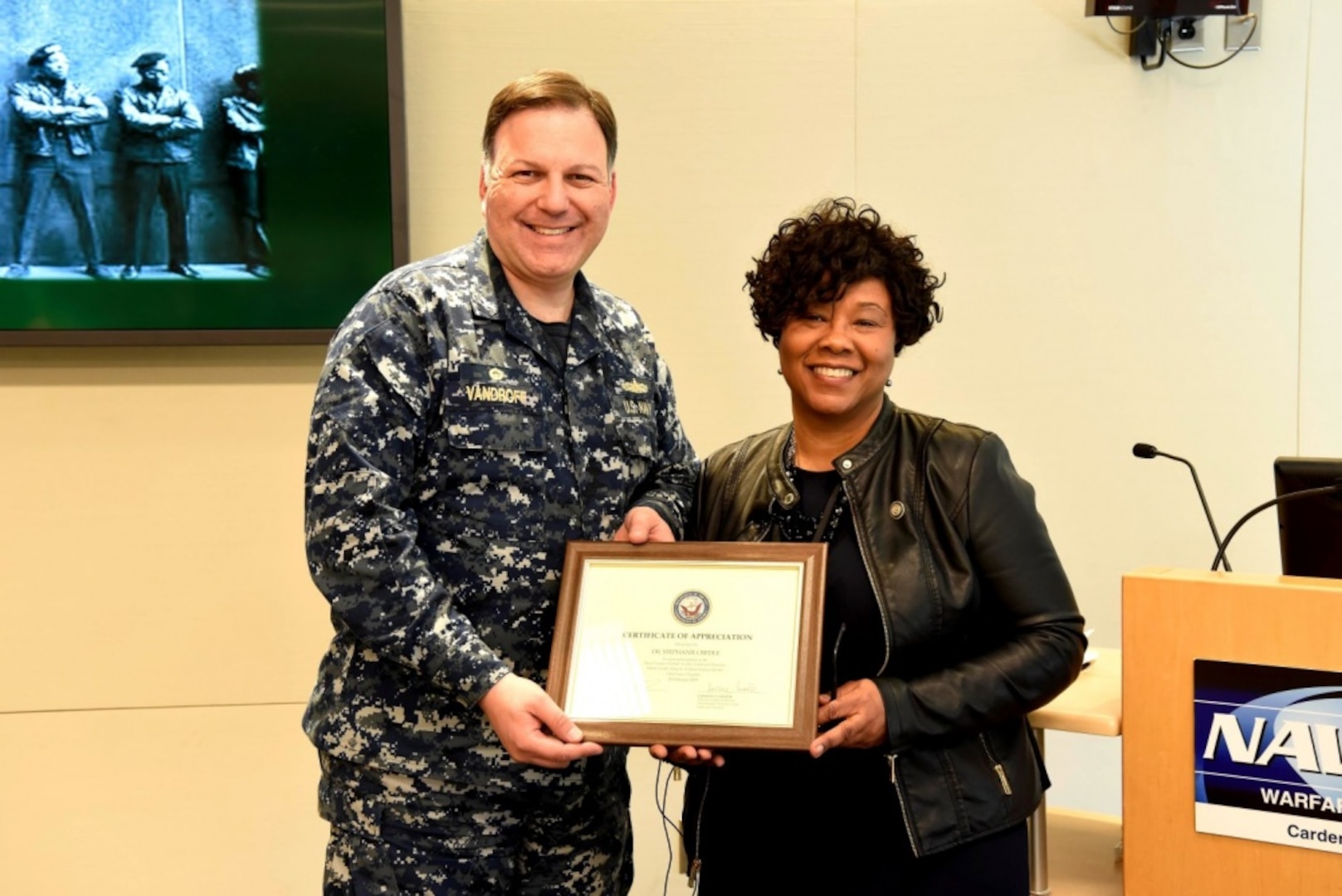 Naval Surface Warfare Center, Carderock Division Commanding Officer Capt. Mark Vandroff presents Dr. Stephanie Hampton Credle a certificate of appreciation at the Black History Month and Dr. Martin Luther King Jr. Day observance event at Carderock™s headquarters in West Bethesda, Md., on Feb. 26, 2019. (U.S. Navy photo by Harry Friedman/Released)