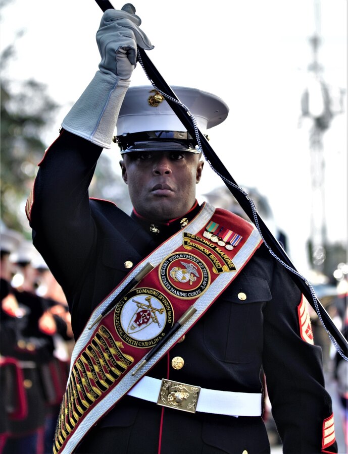 Staff Sgt. Johnte Hall, drum major with the 2nd Marine Division Band participates in a Mardi Gras parade, New Orleans, March 5, 2019. The Marine Corps Band from Camp Lejeune performs in multiple parades annually to help celebrate the Mardi Gras season and to show the Marine Corps' presence in the New Orleans Community. (U.S. Marine Corps photo by Sgt. Dante J. Fries)