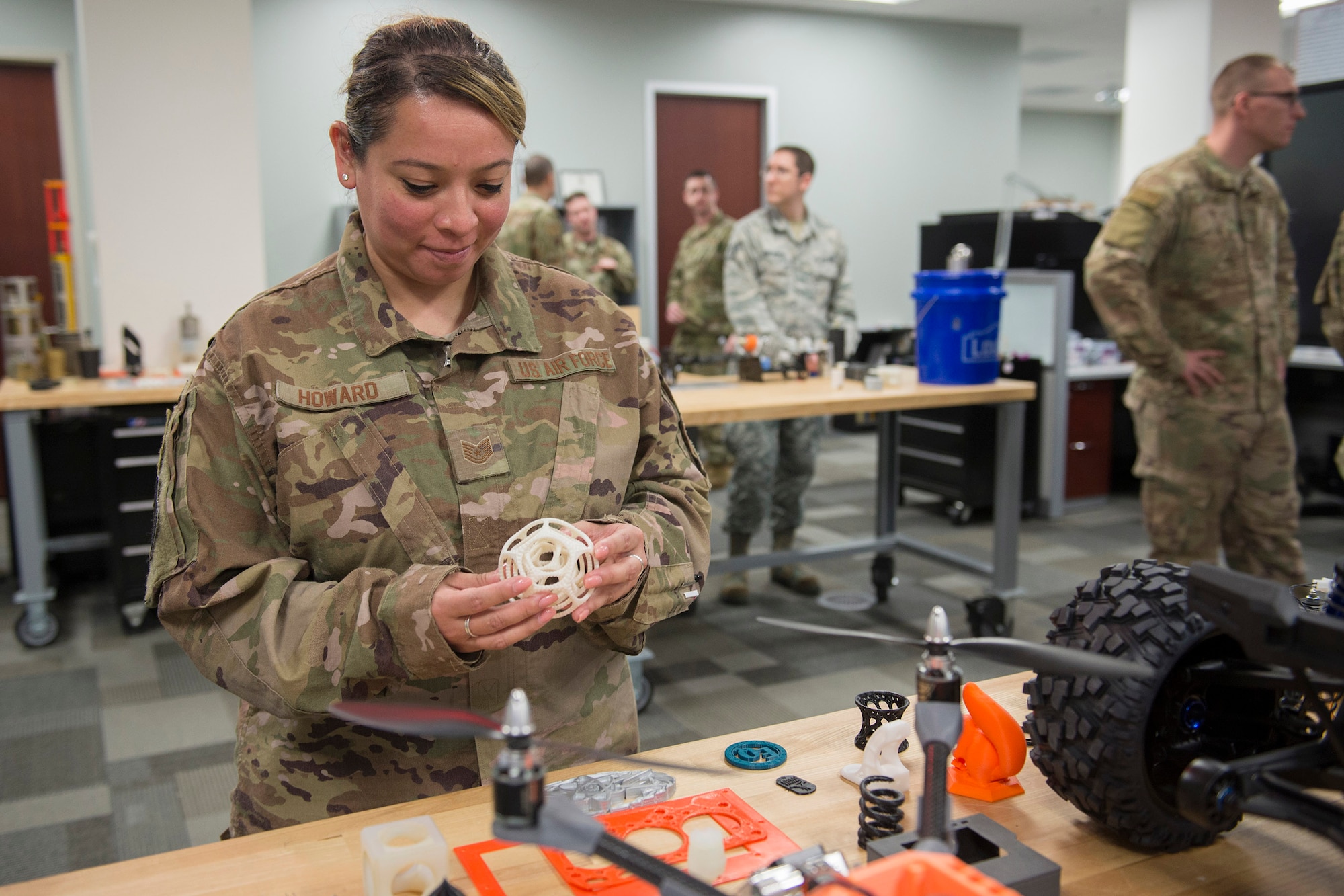 U.S. Air Force Tech. Sgt. Oralia Howard, an Air Force Spark Tank finalist from Royal Air Force Lakenheath whose project dealt with F-15 and F-16 launcher overspray protectors, examines a 3-D sphere created by members of the Air Force Technical Applications Center's Innovation Lab at Patrick Air Force Base, Florida. Howard was one of six finalists who visited the nuclear treaty monitoring center March 1, 2019 to collaborate on innovation. (U.S. Air Force photo by Matthew S. Jurgens)