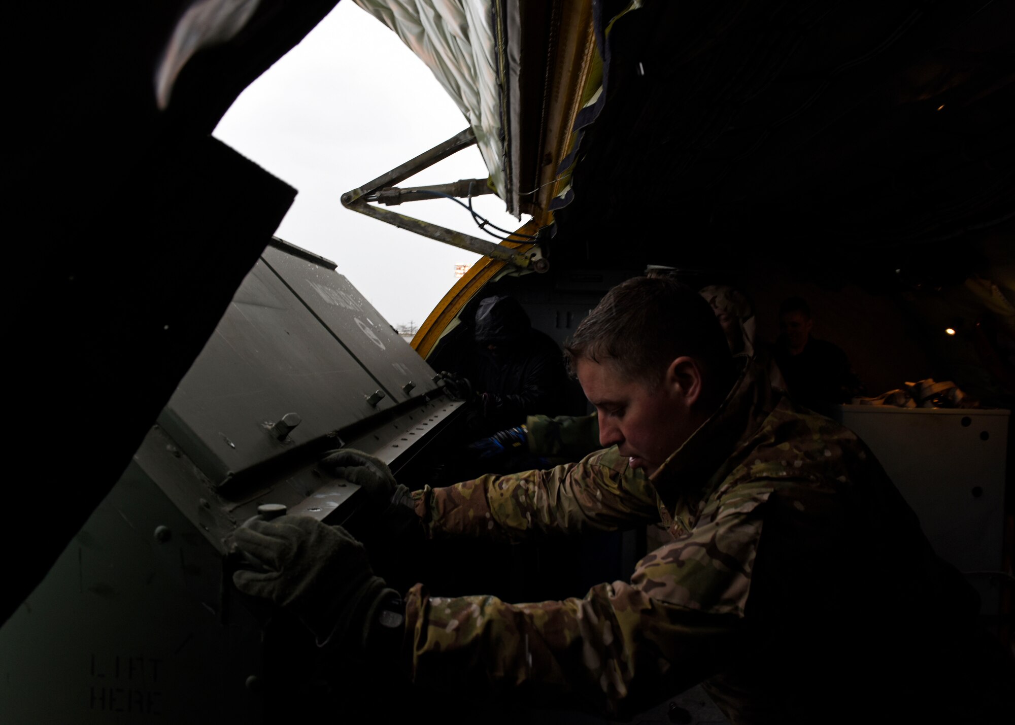 U.S. Air Force Master Sgt. Christopher Staton, 93rd Air Refueling Squadron aircrew training superintendent, pushes cargo onto a K Loader during an Installation Mission Assurance Exercise at Beale Air Force Base, California, Feb. 26, 2019. Beale AFB provided Fairchild Airmen with support through vehicle operations, aerial port, aircraft support equipment and lodging. Additionally, the 940th Air Refueling Wing Air Force Reserve unit at Beale partnered with Fairchild to practice air refueling capabilities in a simulated combat zone. (U.S. Air Force photo by Senior Airman Jesenia Landaverde)