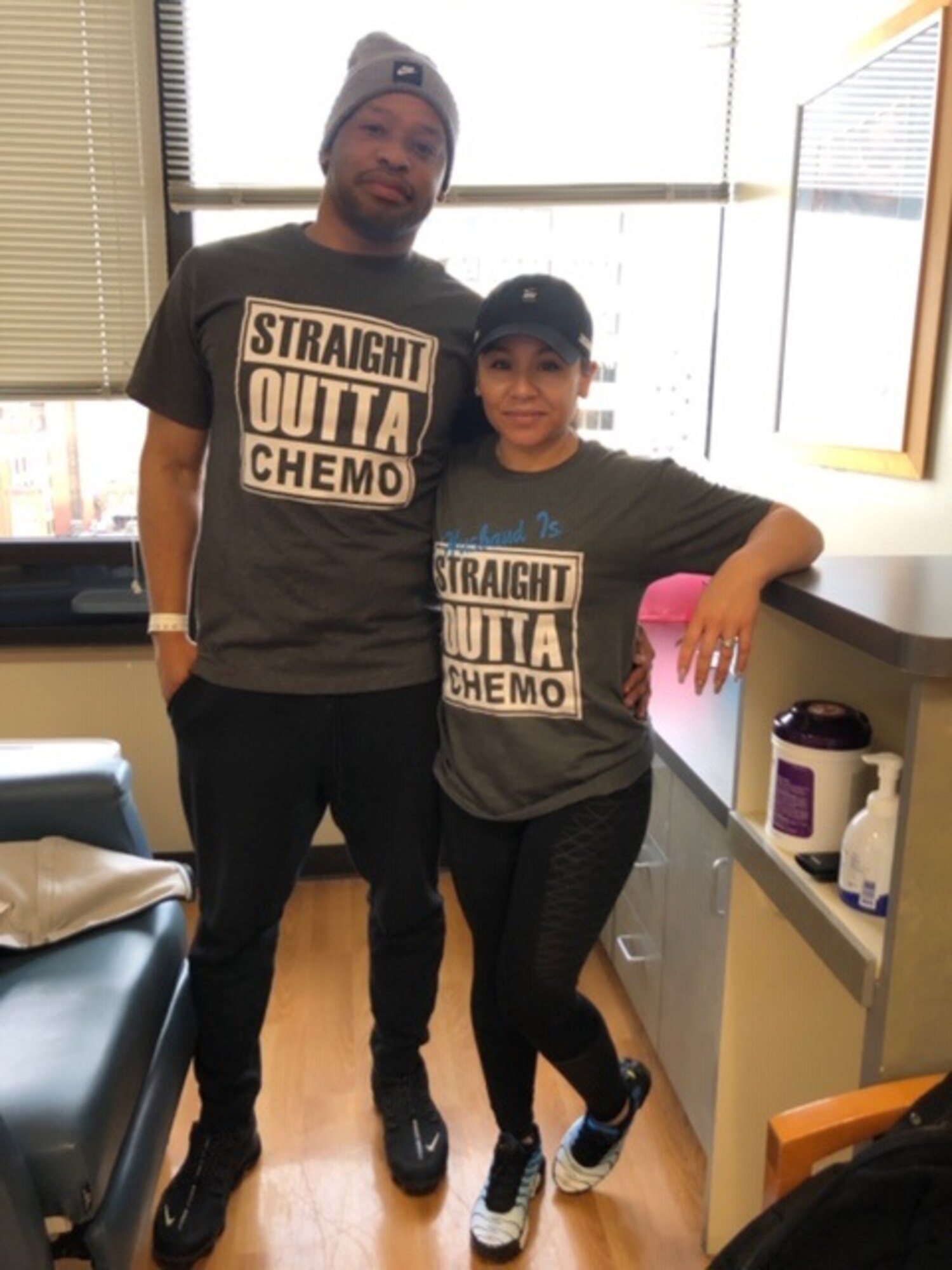 U.S. Air Force Tech. Sgt. Christopher Hicks, 92nd Operations Support Squadron aircrew flight equipment lead trainer, poses with his wife, Desiree Hicks, after completing his final chemotherapy treatment in a year long battle against colon cancer in Spokane, Washington. Hicks reached complete remission Feb. 8, 2019, through personal persistence and tenacious team support. (U.S. Air Force courtesy photo)