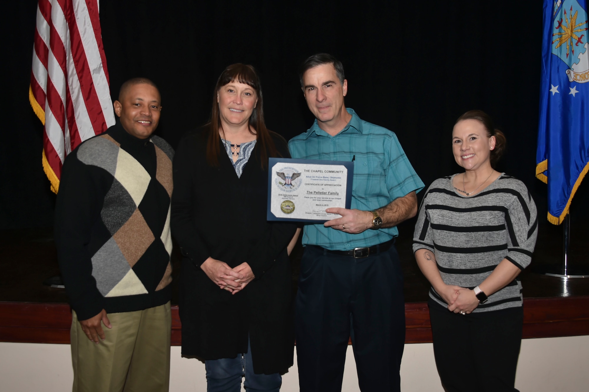 The Pelletier family was awarded the Gold-Level Presidential Volunteer Service Award, March 2, 2019, at Altus Air Force Base, Okla. (U.S. Air Force photo by Senior Airman Cody Dowell)