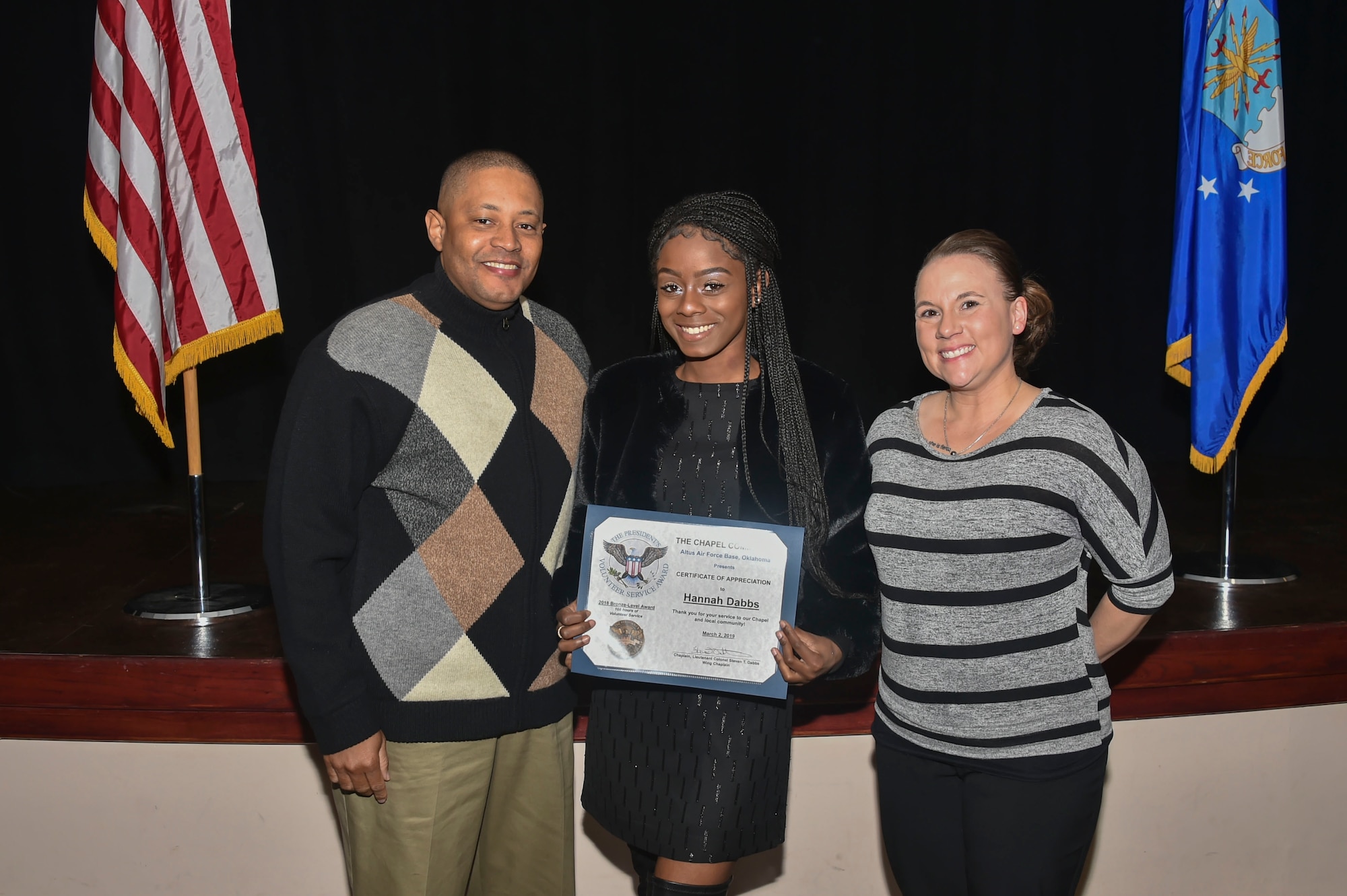 Hannah Dabbs, daughter of U.S. Air Force Chaplain Lt. Col. Steven Dabbs, 97th Air Mobility Wing head chaplain, was awarded the Bronze-Level Presidential Volunteer Service Award, March 2, 2019, at Altus Air Force Base, Okla. (U.S. Air Force photo by Senior Airman Cody Dowell)