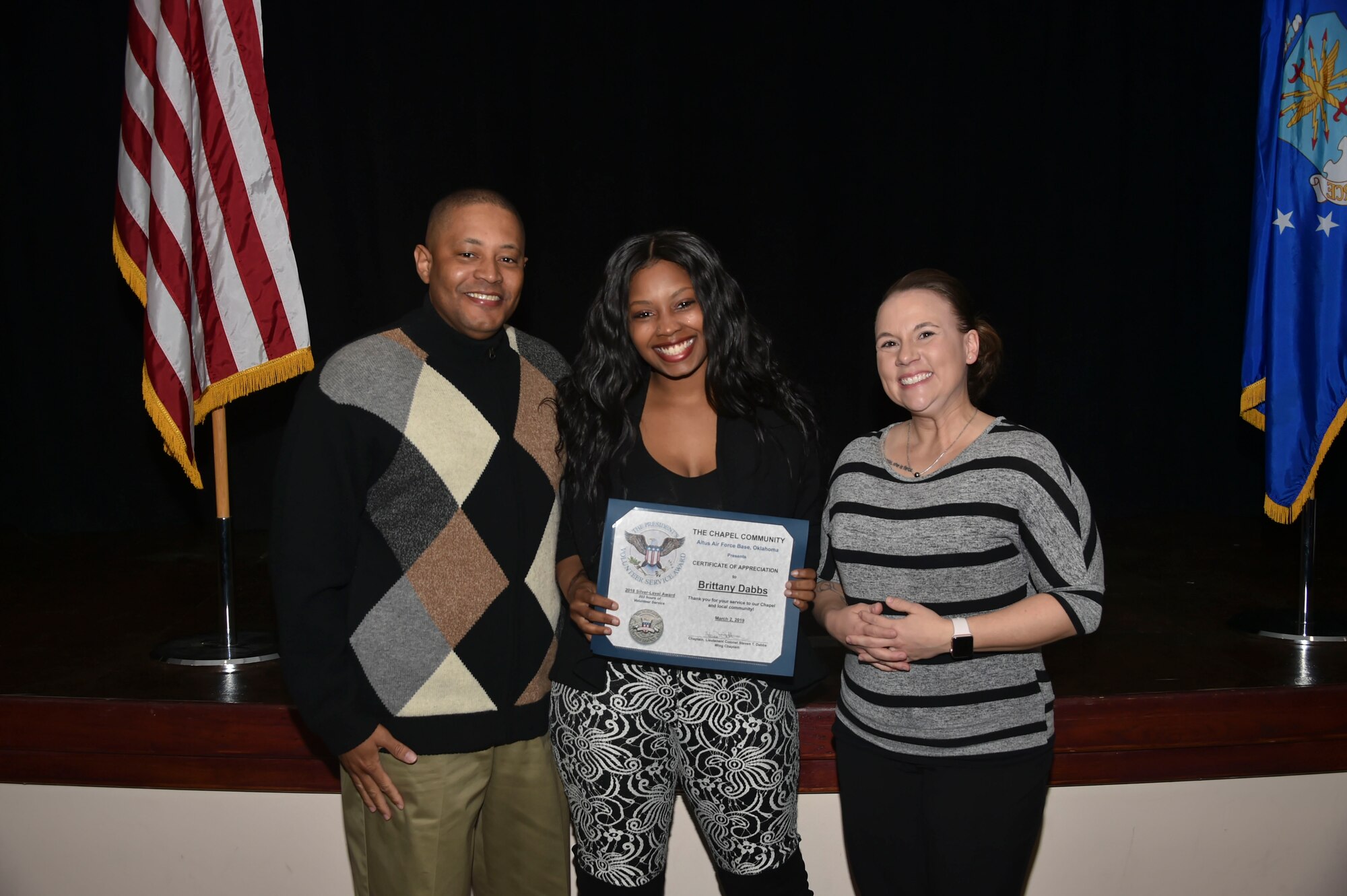 Brittany Dabbs, daughter of U.S. Air Force Chaplain Lt. Col.  Steven Dabbs, 97th Air Mobility Wing head chaplain, was awarded the Silver-Level Presidential Volunteer Service Award, March 2, 2019, at Altus Air Force Base, Okla. (U.S. Air Force photo by Senior Airman Cody Dowell)