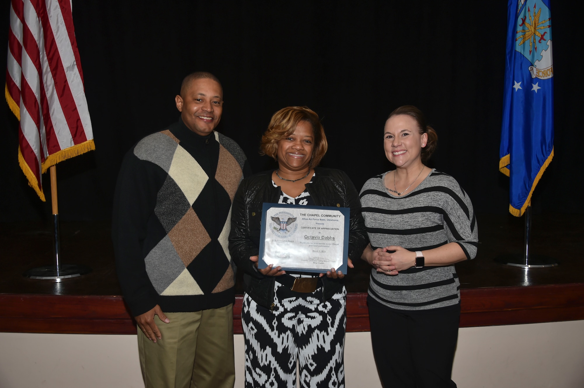 Octavia Dabbs, wife of U.S. Air Force Chaplain Lt. Col. Steven Dabbs, 97th Air Mobility Wing head chaplain, was awarded the Silver-Level Presidential Volunteer Service Award, March 2, 2019, at Altus Air Force Base, Okla.  (U.S. Air Force photo by Senior Airman Cody Dowell)