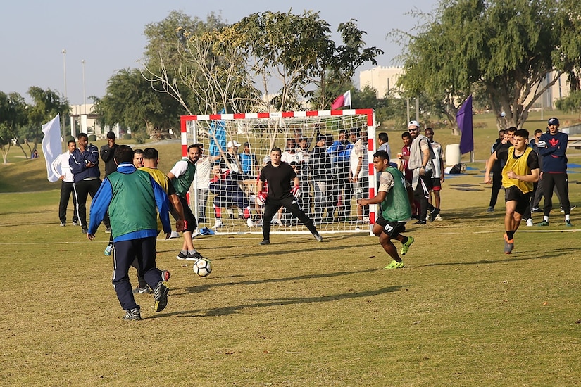 Members of Area Support Group-Qatar, in yellow, played in a soccer tournament with Qatari military Forces Feb. 12, 2019 in Doha during their National Sports Day. The engagement is part of sports diplomacy that might open more opportunities in the future.
