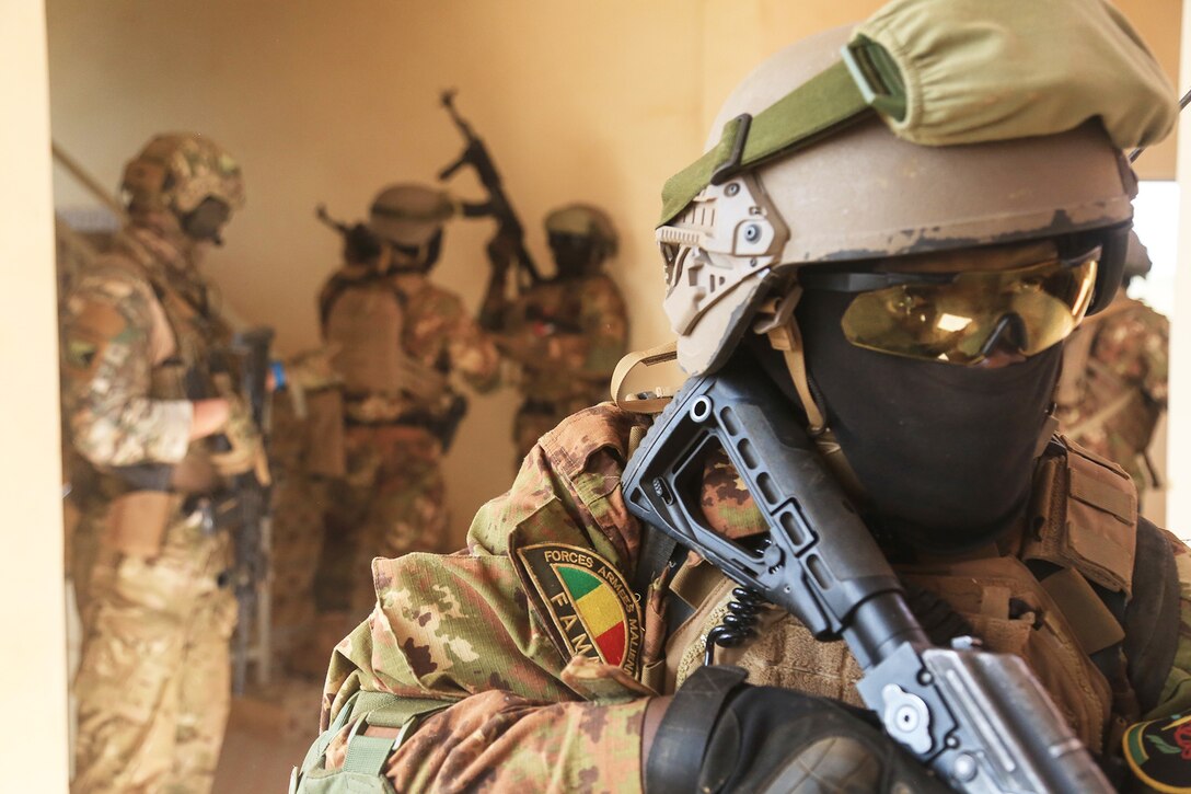 Soldiers clear rooms.