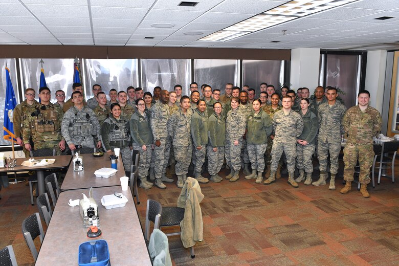 Col. Jennifer Grant, 50th Space Wing commander, and Chief Master Sgt. Boston Alexander, 50th Space Wing command chief, gather with Airmen during the Airmen’s Lunch at the Satellite Dining Dish Facility, Schriever Air Force Base, Colorado, March 5, 2019. More than 40 Airmen from a variety of squadrons attended the luncheon to ask questions about the future of the base and interact with wing leadership. (U.S. Air Force photo by Dennis Rogers)