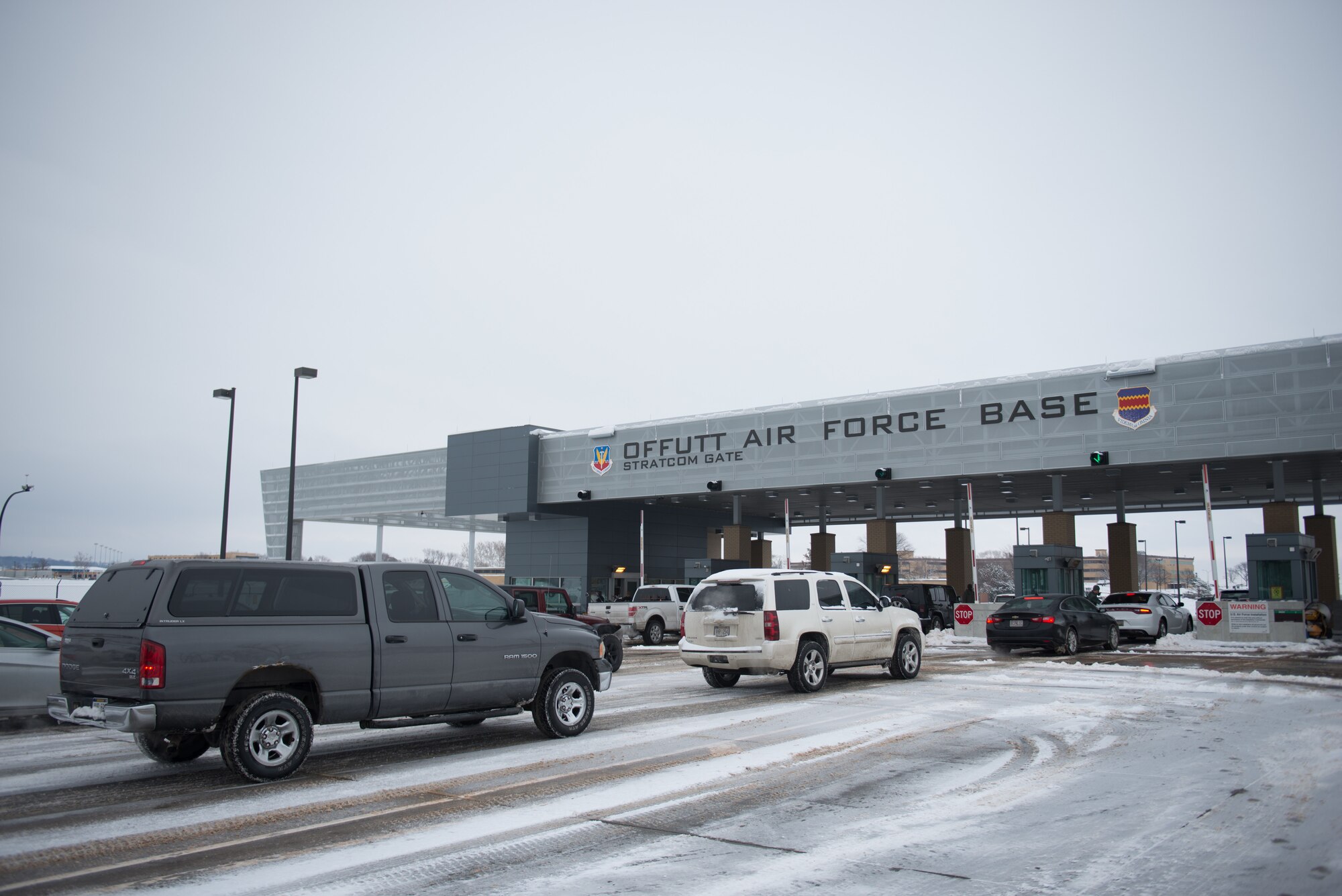Cars wait in lanes to enter the U.S. Strategic Command gate March 7, 2019, on Offutt Air Force Base. The base was issues a delayed reporting due to snowfall overnight. (U.S. Air Force photo by Tech. Sgt. Rachelle Blake)