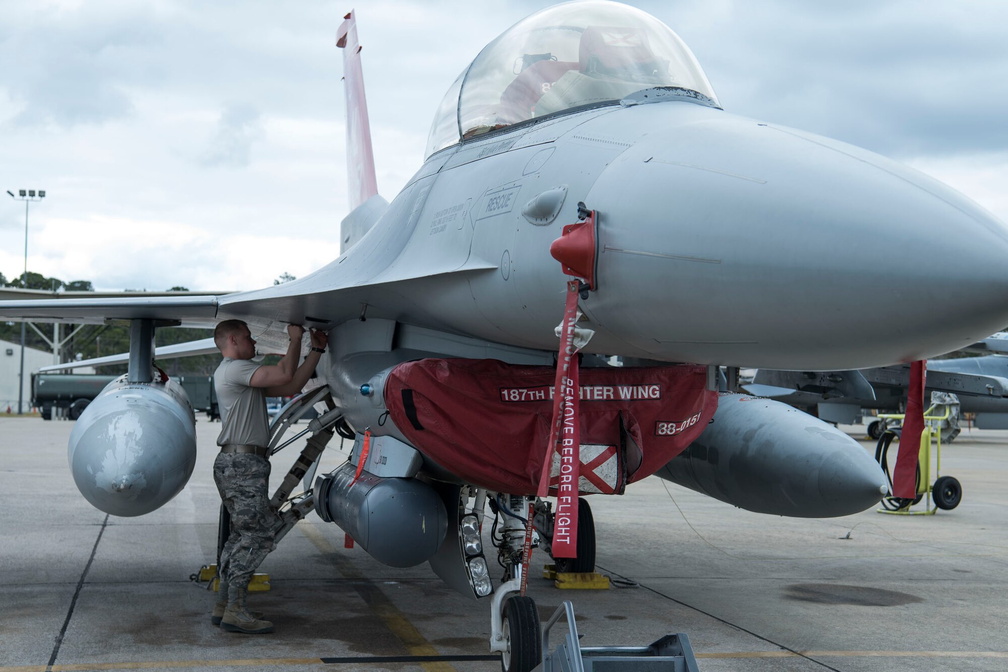 Staff Sergeant Jonathan Gill inspects F-16