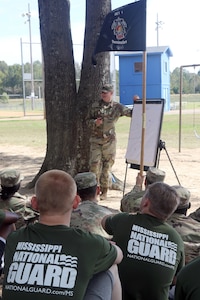 Sgt. 1st Class Alec Donahoe, a drill sergeant with the Mississippi Army National Guard's Recruiting and Retention Battalion, teaches squad movement tactics to newly enlisted Mississippi Army Guard Soldiers assigned to the Recruit Sustainment Program, Oct. 7, 2017, in Senatobia, Miss.