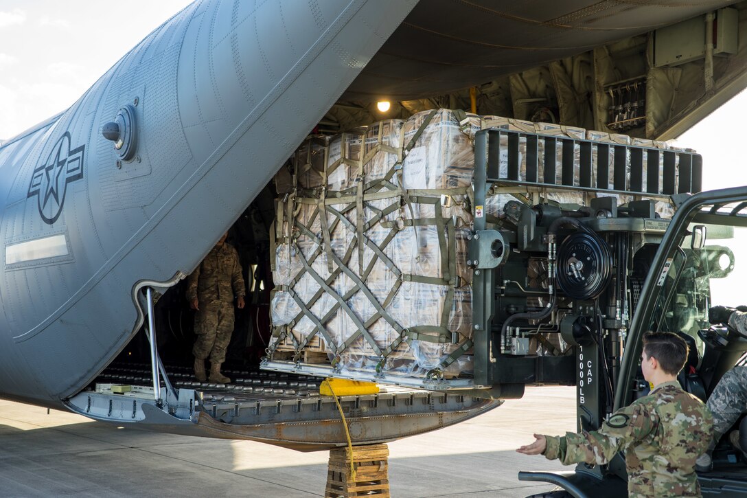 Humanitarian aid, including medical supplies, is loaded on a U.S. Air Force C-130J cargo aircraft for transport to Cúcuta, Colombia.