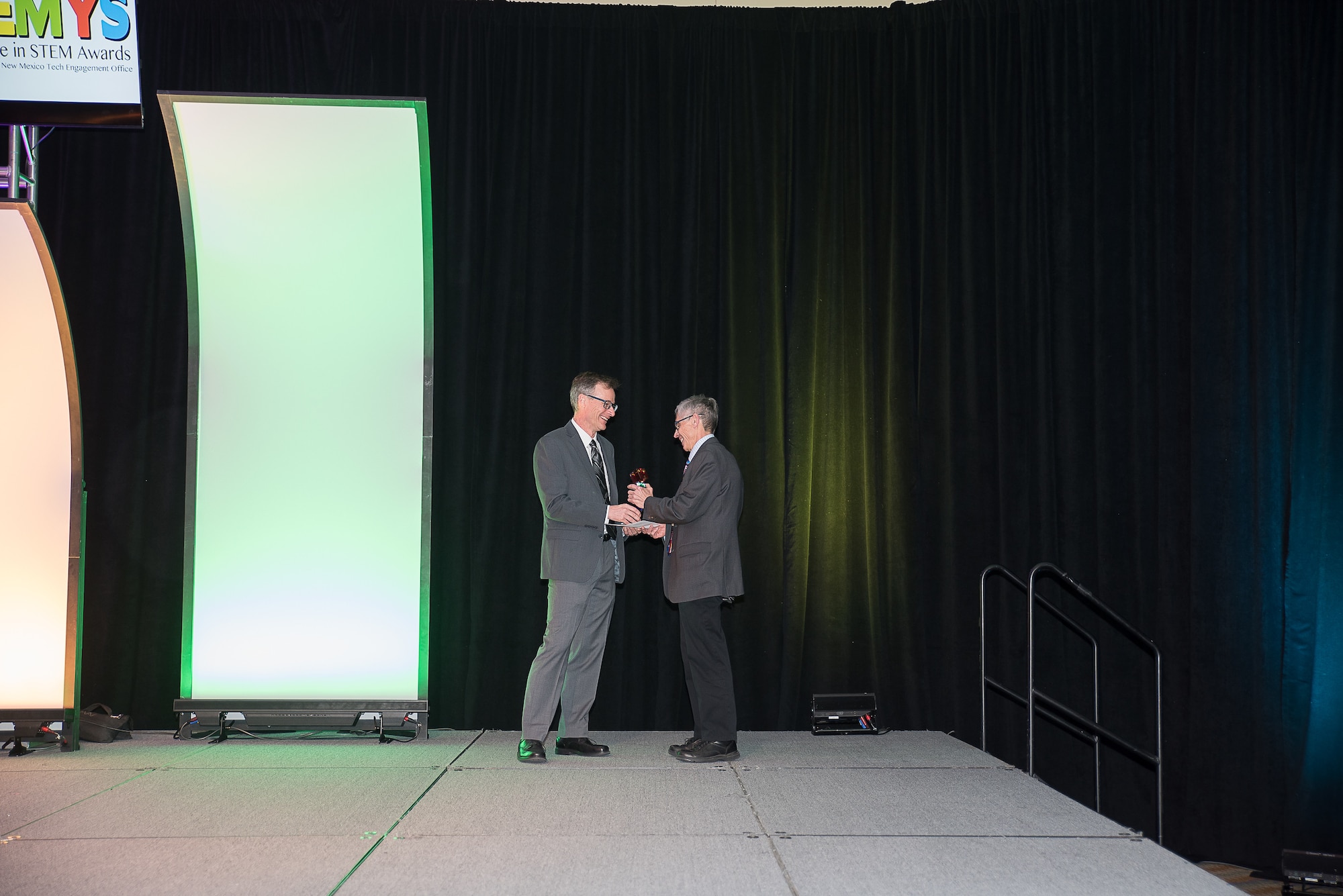 Matt Fetrow (left) presents Dr. Len Duda the Lifetime Achievement award at the Air Force Research Laboratory sponsored 2019 Second Annual Excellence in STEM event. Dr. Duda is a retired Sandia National Labs scientist who volunteers hundreds of hour every year for STEM activities. Photo credit: Courtesy