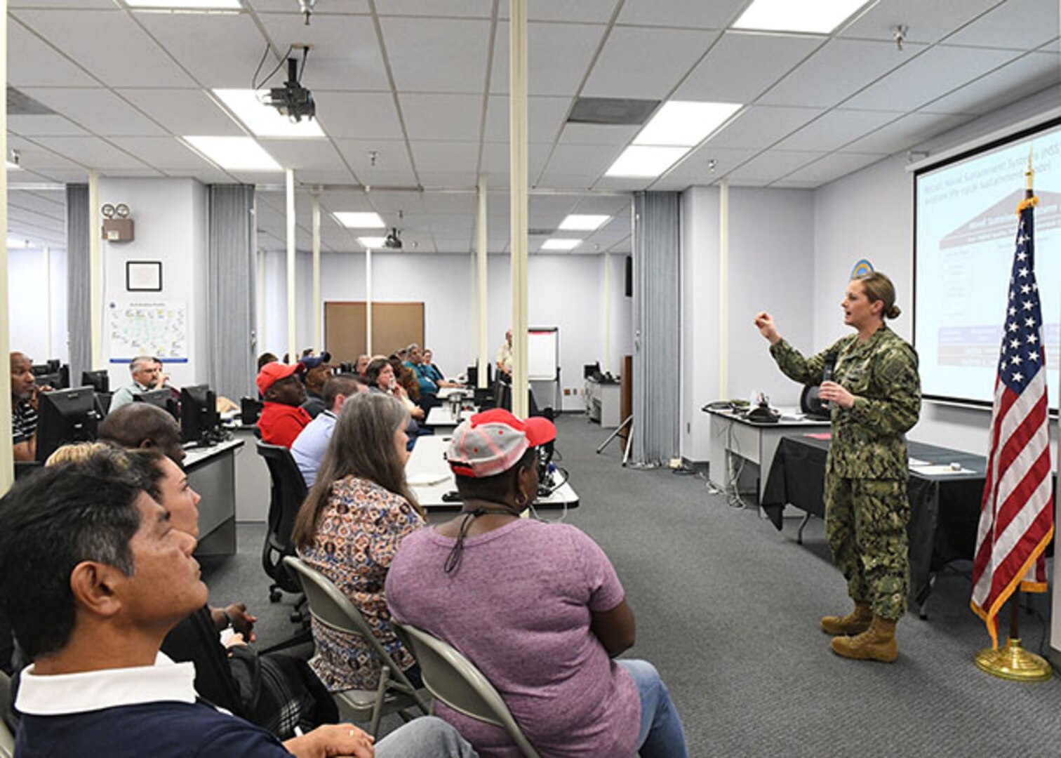 Cmdr Frey speaks with employees