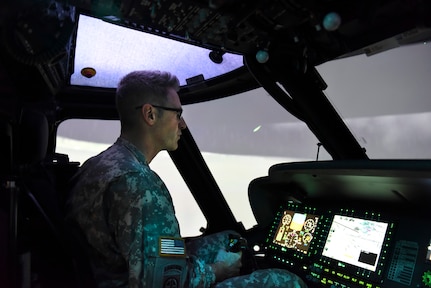 Army Chief Warrant Officer 4 Mark Ulsh, an instructor pilot with the Pennsylvania Army National Guard’s Eastern Army National Guard Aviation Training Site, flies a training mission using the UH-60 Black Hawk Air Crew Trainer flight simulator at Fort Indiantown Gap, Pa., Feb. 27, 2019. Simultors allow pilots to train in a variety of simulated environments, giving pilots tough, realistic training while saving millions of dollars annually over flying actual aircraft.