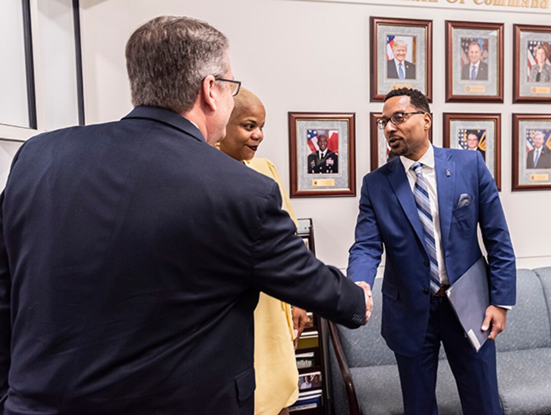 Steve Alsup, the deputy commander of Defense Logistics Agency Land and Maritime, greets Franklin County Commissioner Kevin Boyce Feb. 27 during an office call at the Defense Supply Center Columbus.