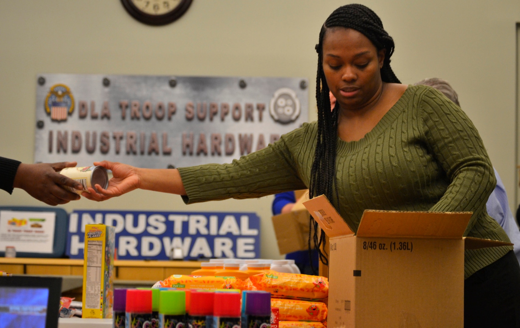 DLA Troop Support Industrial Hardware employee and “IH Trooper” Temecca Baen places items in a “Trooper Treat Box” care package March 6, 2019 in Philadelphia.