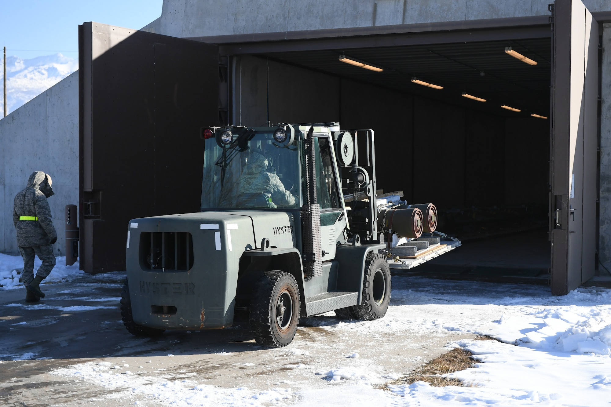 Airmen assigned to the 649th Munitions Squadron transfer BLU-109 Penetrator bombs into an earth-covered storage magazine at Hill Air Force Base, Utah, during a readiness inspection Jan. 30, 2019. (U.S. Air Force photo by Cynthia Griggs)