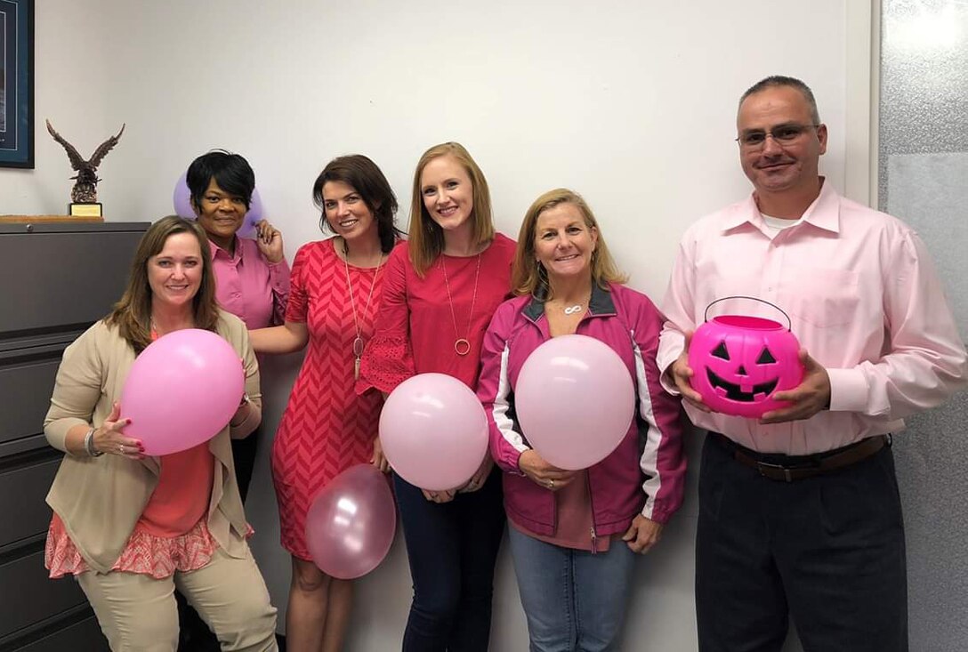 The 301st Civilian Personal Section dress up in all pink to increase breast cancer awareness October 17, 2018 at Naval Air Station Fort Worth Joint Reserve Base, Texas. They play a vital role in helping the wing achieve one of its most important priorities - recruit, retain, and train quality Airmen. (Courtesy Photo)