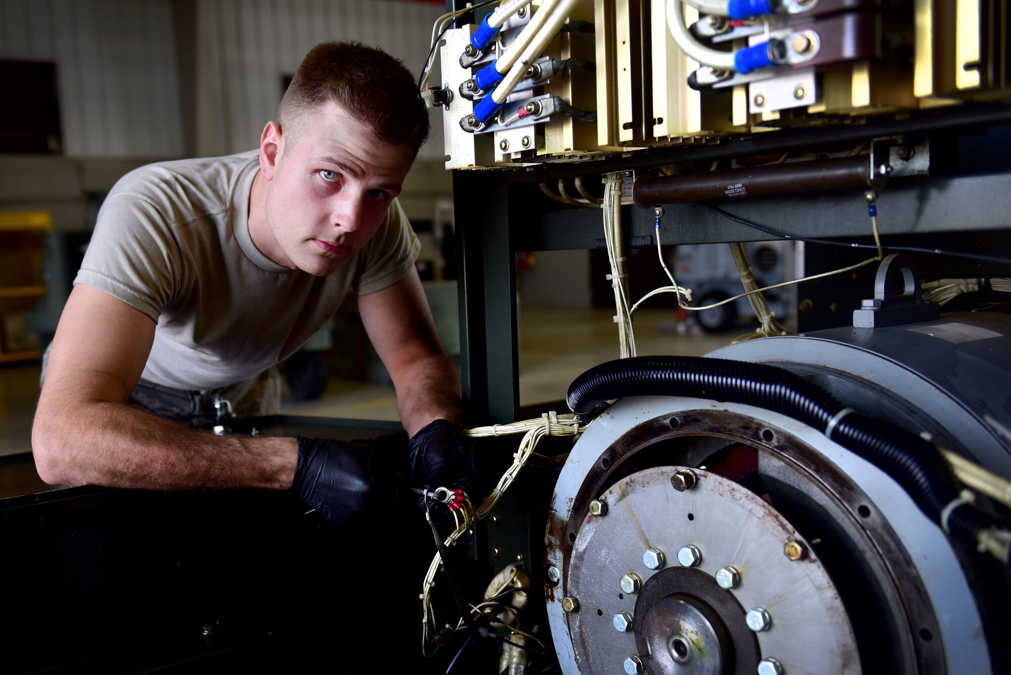 A man works on a piece of equipment.