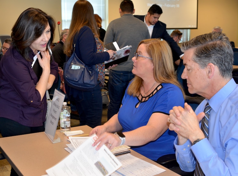 Juliana Montoya, chief, Military & IIS Section (center); and Michael Goodrich, chief, Military & IIS Project Management Branch, visit with an interested contractor during the District’s Industry Day, Feb. 6, 2019.
