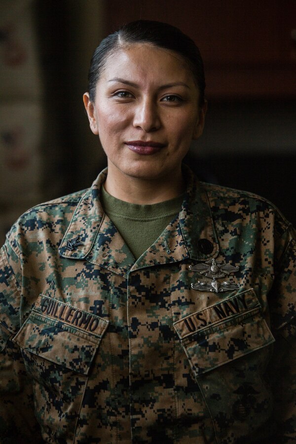 Petty Officer 2nd Class Nancy Guillermo, a religious program specialist with 1st Marine Aircraft wing, stands at attention on Camp Foster, Okinawa, Japan, Feb. 5, 2019. Guillermo was highlighted for being a Sailor of outstanding quality. (U.S. Marine Corps photo by Lance Cpl. Hannah Hall)
