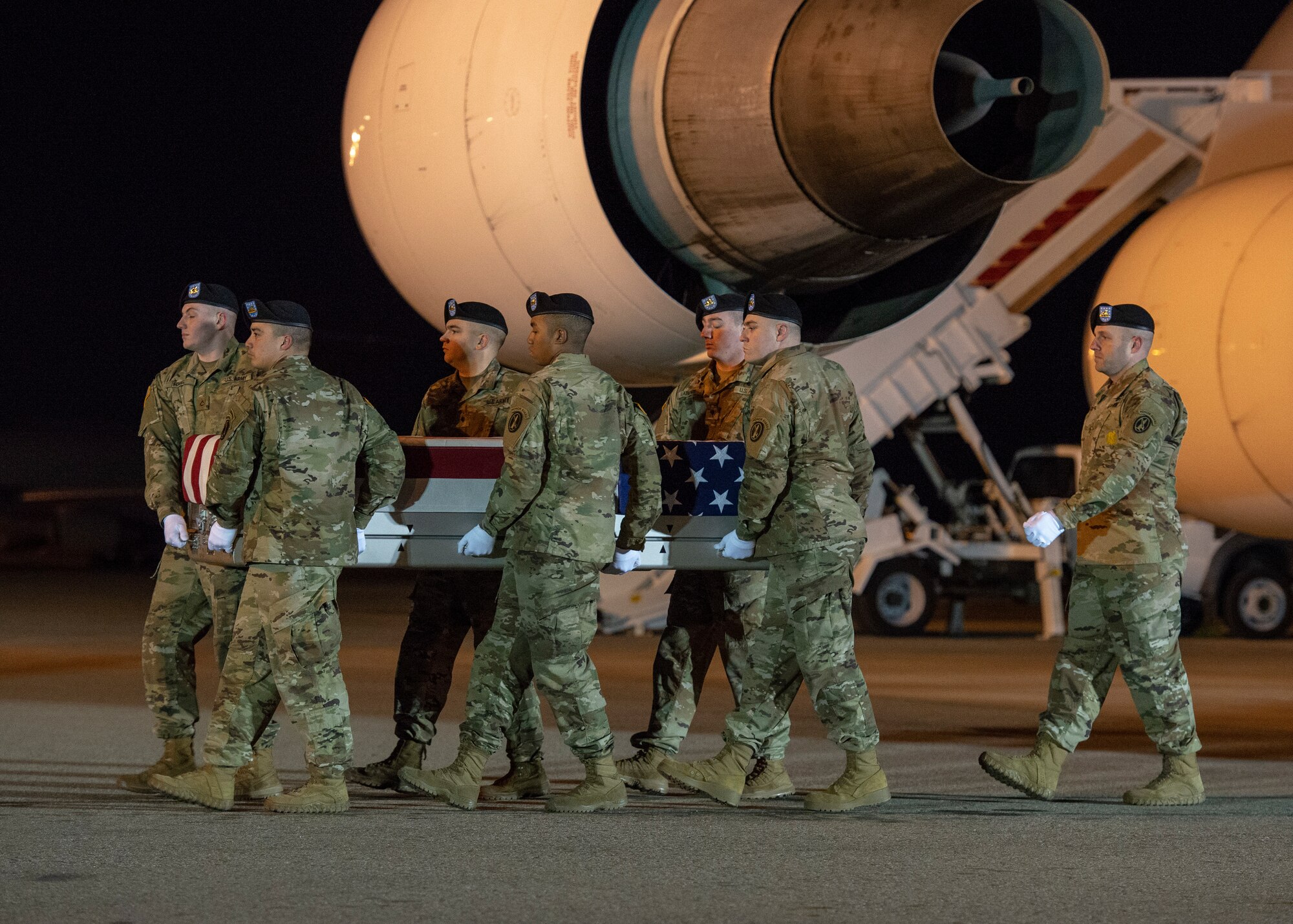 A U.S. Army carry team transfers the remains of Army Spc. Jackson D. Johnson of Hillsboro, Mo., March 7, 2019, at Dover Air Force Base, Del. Johnson was assigned to 657th Transportation Company, 419th Transportation Battalion, 103rd Sustainment Command, Mount Vernon, Ill. (U.S. Air Force photo by Staff Sgt. Jared Duhon)