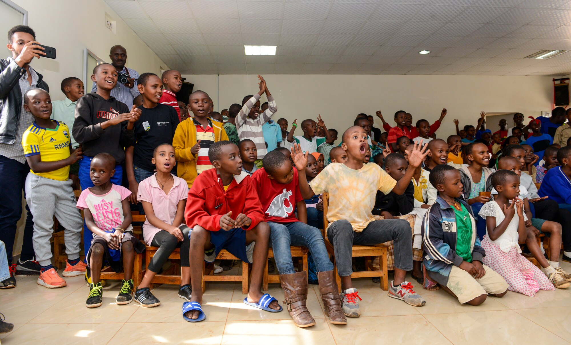 Students sing and clap along to music played by the U.S. Air Forces in Europe Band Touch N' Go during a performance at the Gisimba Memorial Centre in Kigali, Rwanda, March 6, 2019. As musical ambassadors, members of the band can reach audiences that traditional military members can't. They travel the world to build cultural bridges, and honor and preserve cultural heritage. (U.S. Air Force photo by Tech. Sgt. Timothy Moore)