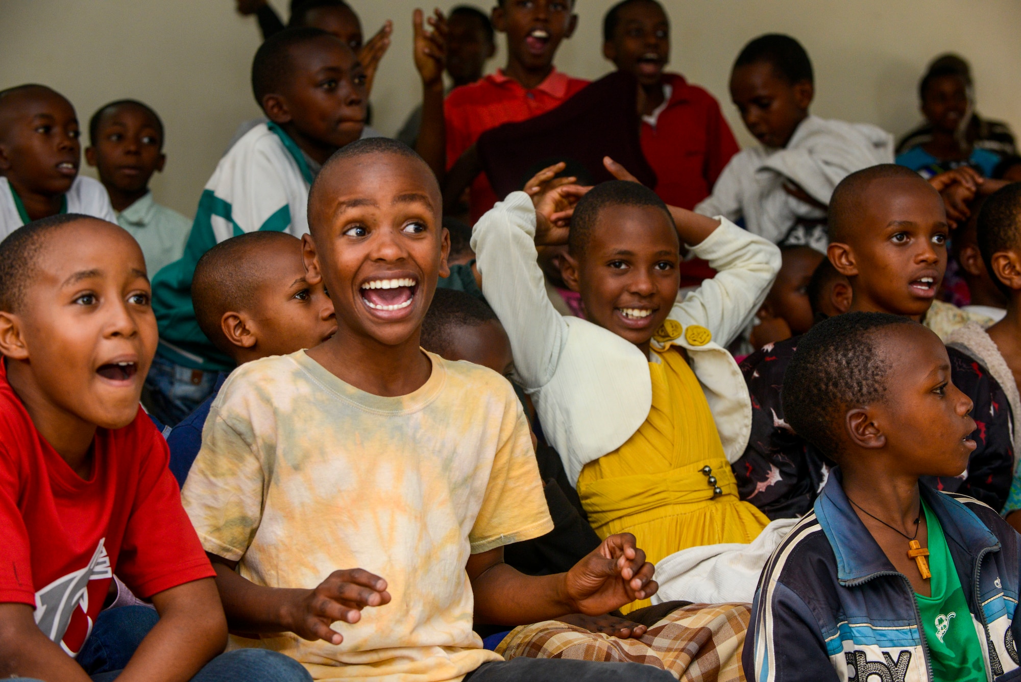 Students sing along to music played by the U.S. Air Forces in Europe Band Touch N' Go during a performance at the Gisimba Memorial Centre in Kigali, Rwanda, March 6, 2019. As musical ambassadors, members of the band can reach audiences that traditional military members can't. They travel the world to build cultural bridges, and honor and preserve cultural heritage. (U.S. Air Force photo by Tech. Sgt. Timothy Moore)