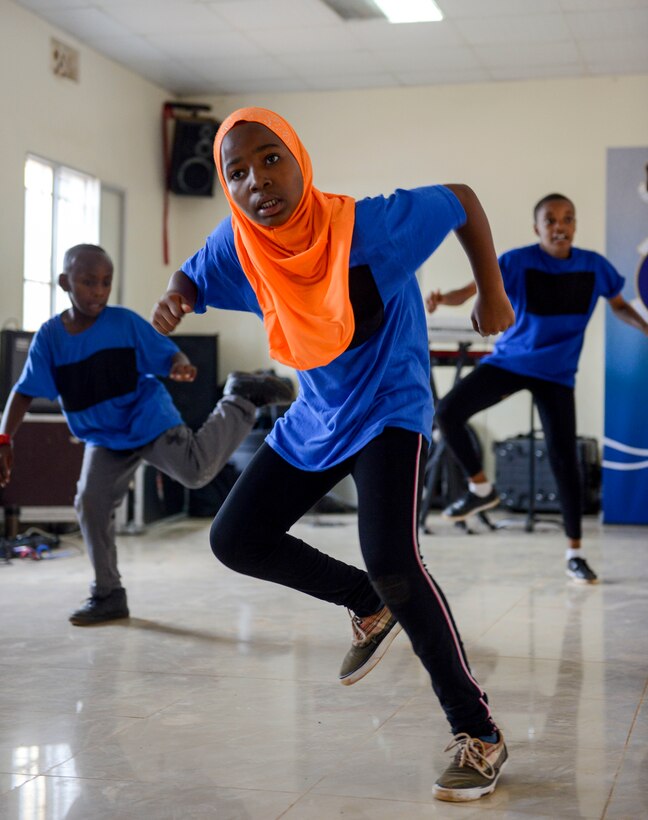 Students perform a dance at the Gisimba Memorial Centre in Kigali, Rwanda, March 6, 2019. After watching a performance by the U.S. Air Forces in Europe Band Touch N' Go, the students wanted to perform for the band. (U.S. Air Force photo by Tech. Sgt. Timothy Moore)